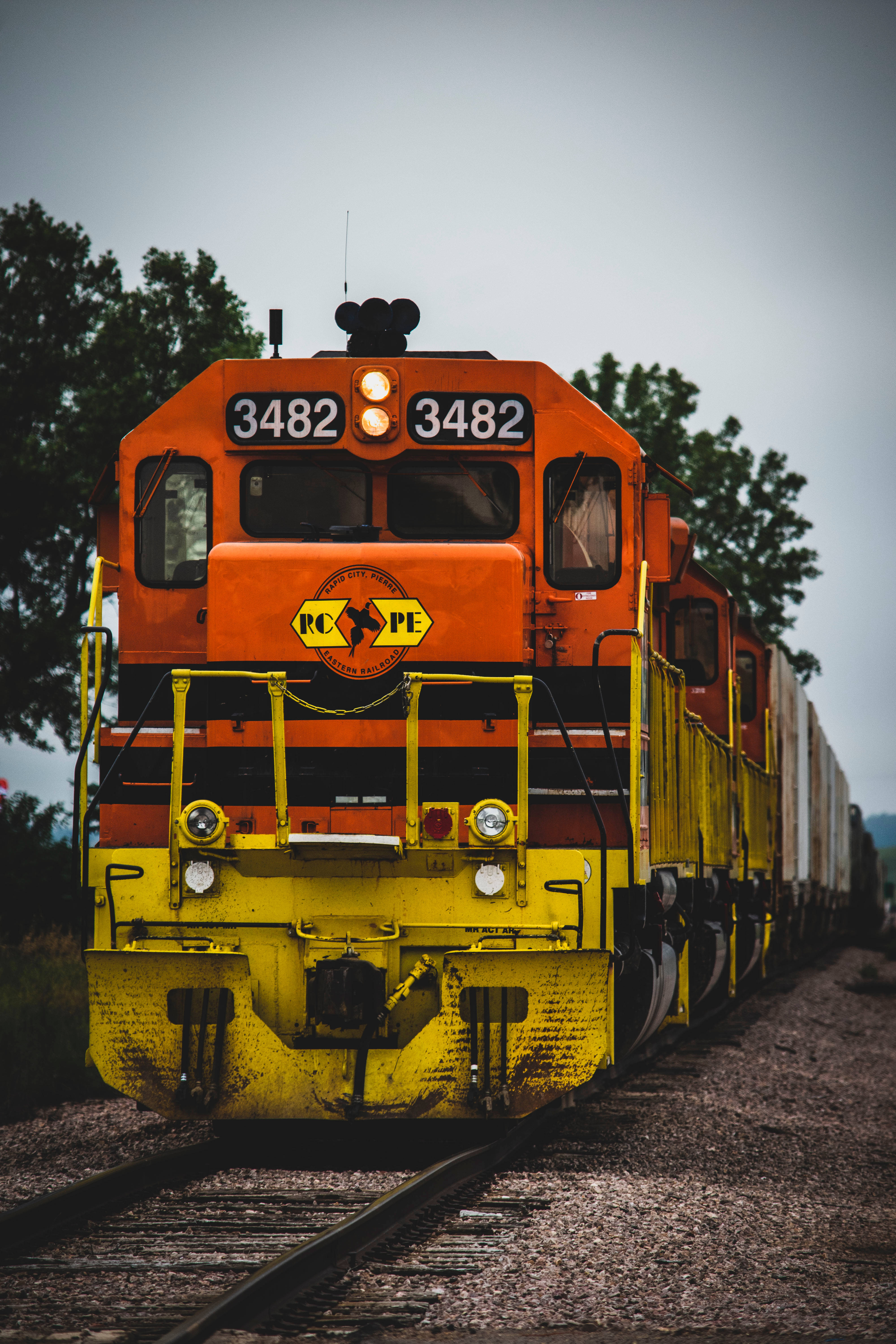 orange and yellow freight train engine, numbered 3482, tracks, 5K Phone Wallpaper