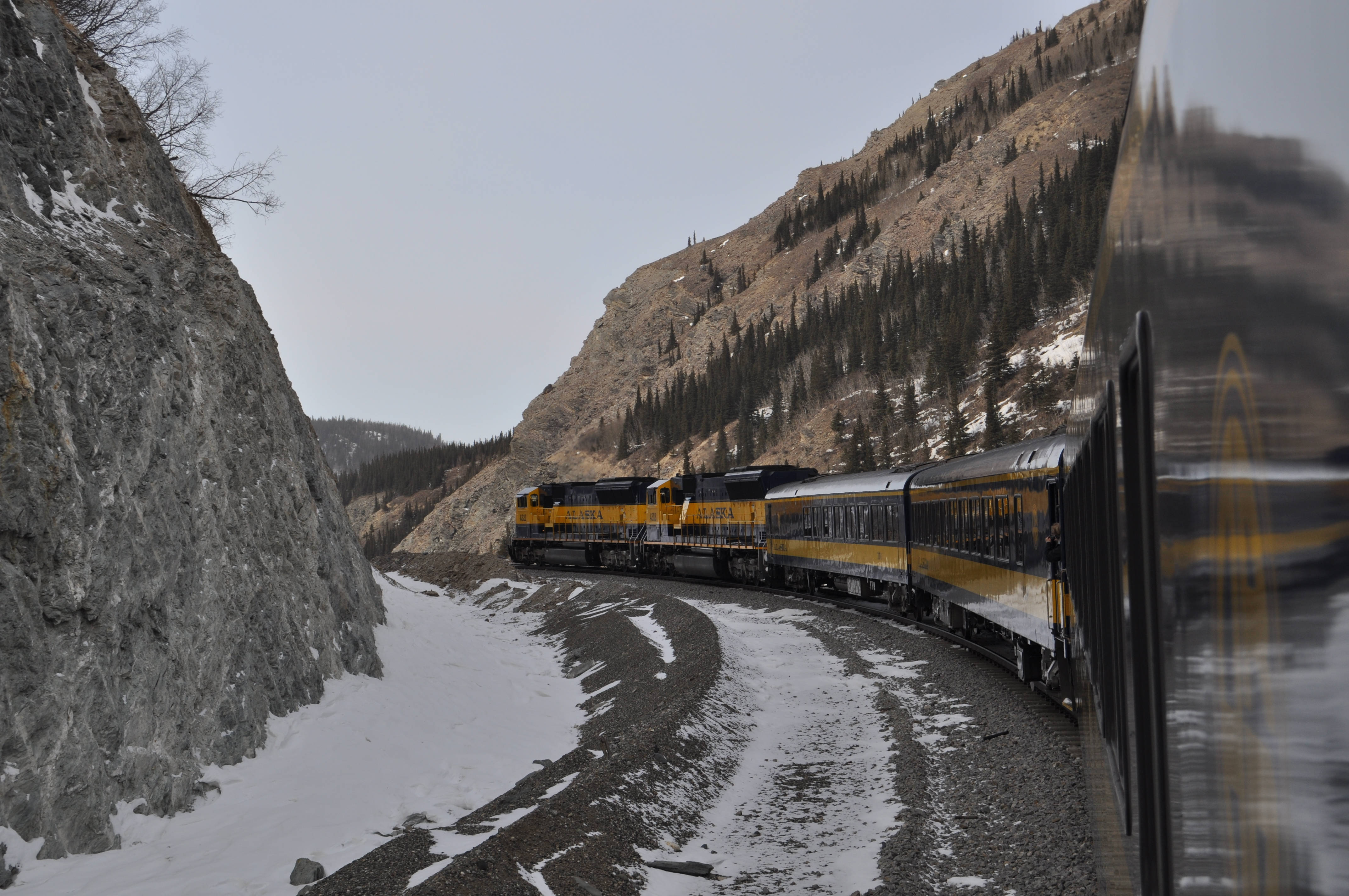 yellow and black train, snowy mountain pass, rocky cliffs, 4K Desktop Wallpaper