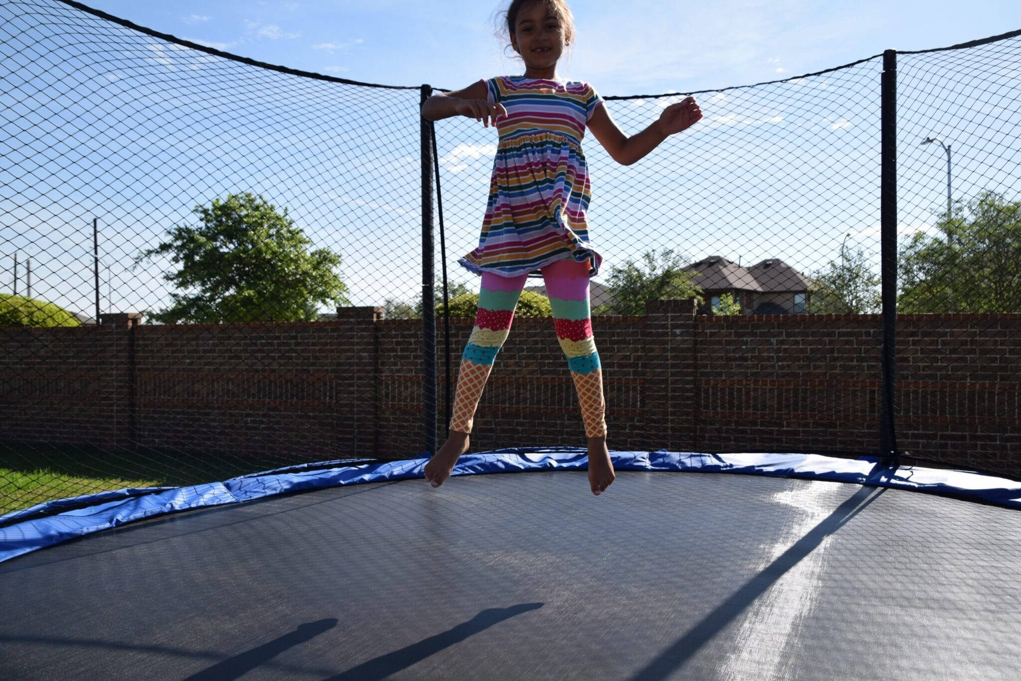 trampoline, girl, colorful striped outfit, Full HD Desktop Wallpaper