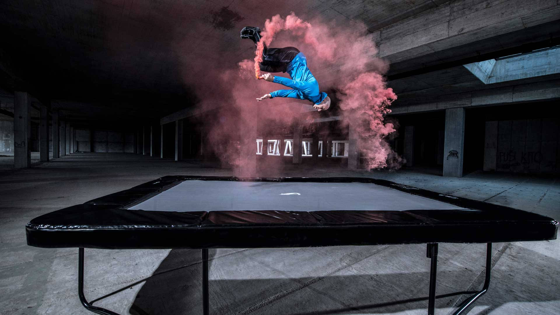 trampoline, blue jumps midair, dark concrete warehouse, Full HD Desktop Wallpaper