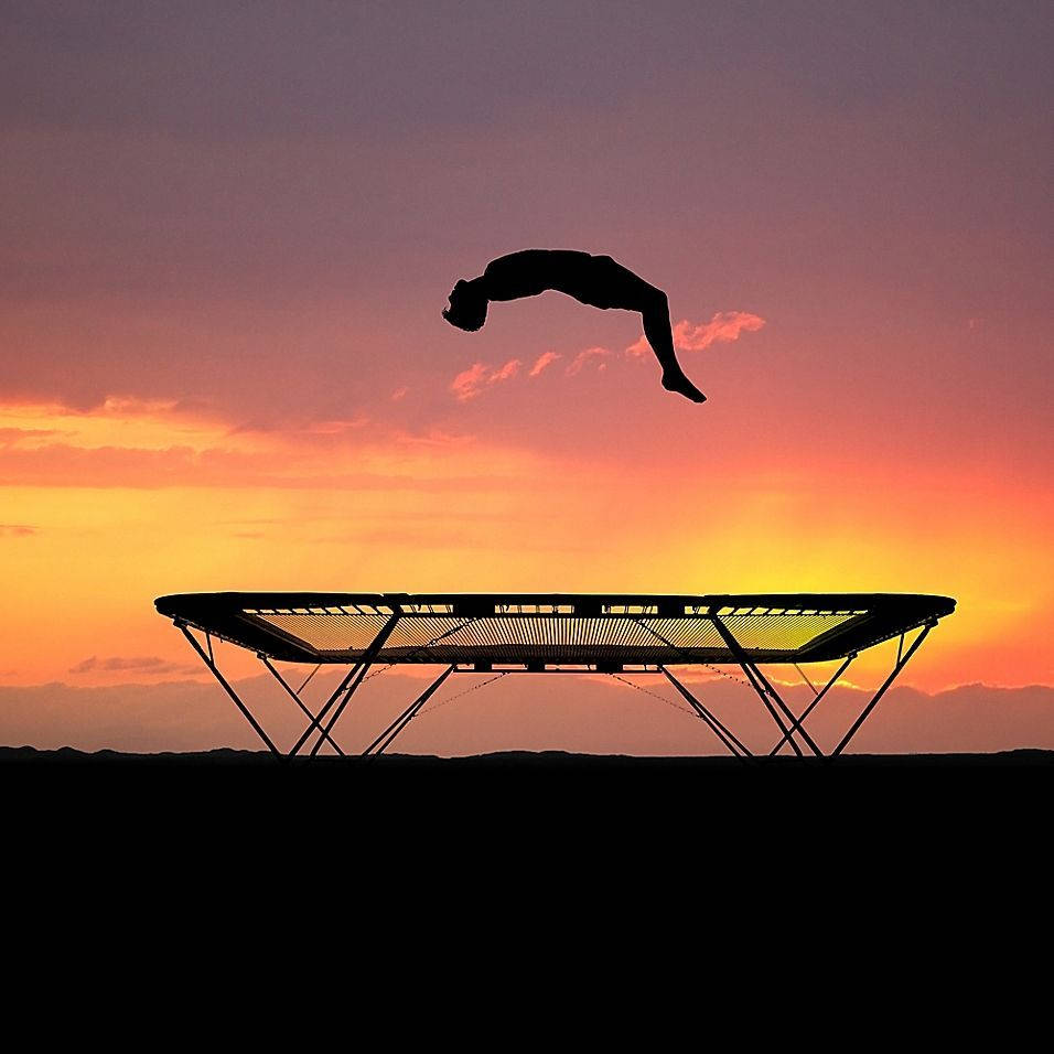 silhouetted man, trampoline, vibrant sunset sky, SD Desktop Wallpaper