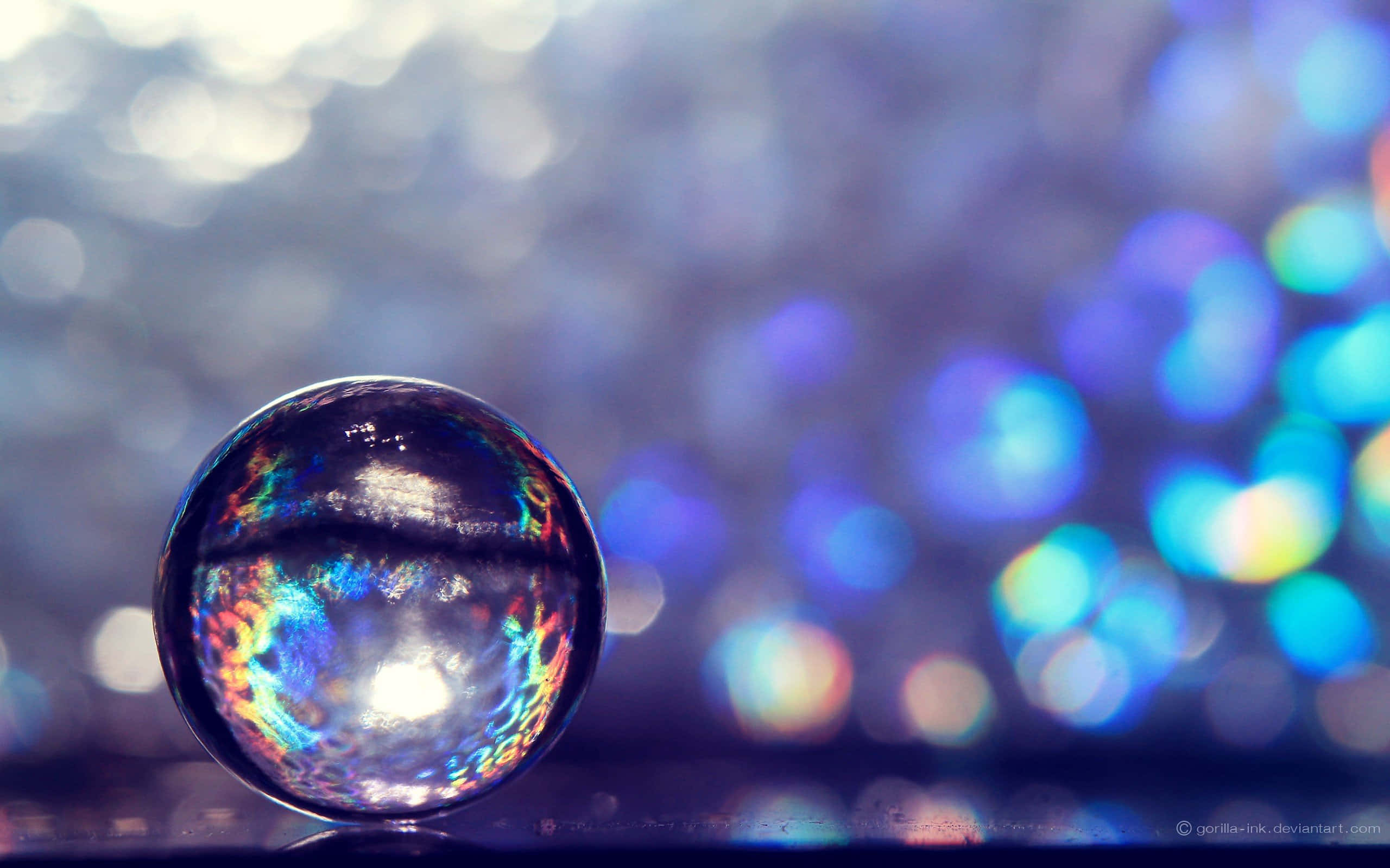 glass sphere, vibrant rainbow light, dreamy blue bokeh background, 2K Desktop Wallpaper
