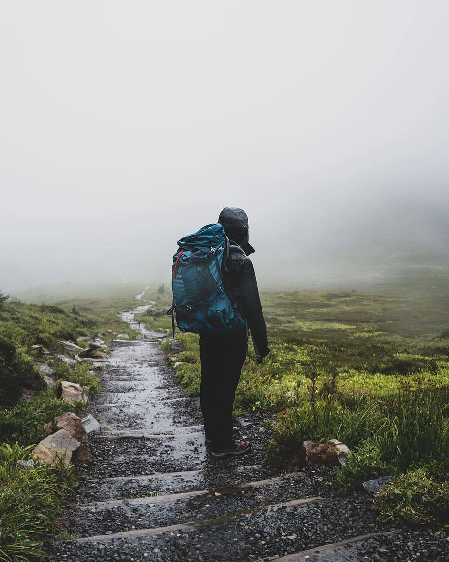 Hiker, blue backpack, wet stone path, SD Phone Wallpaper