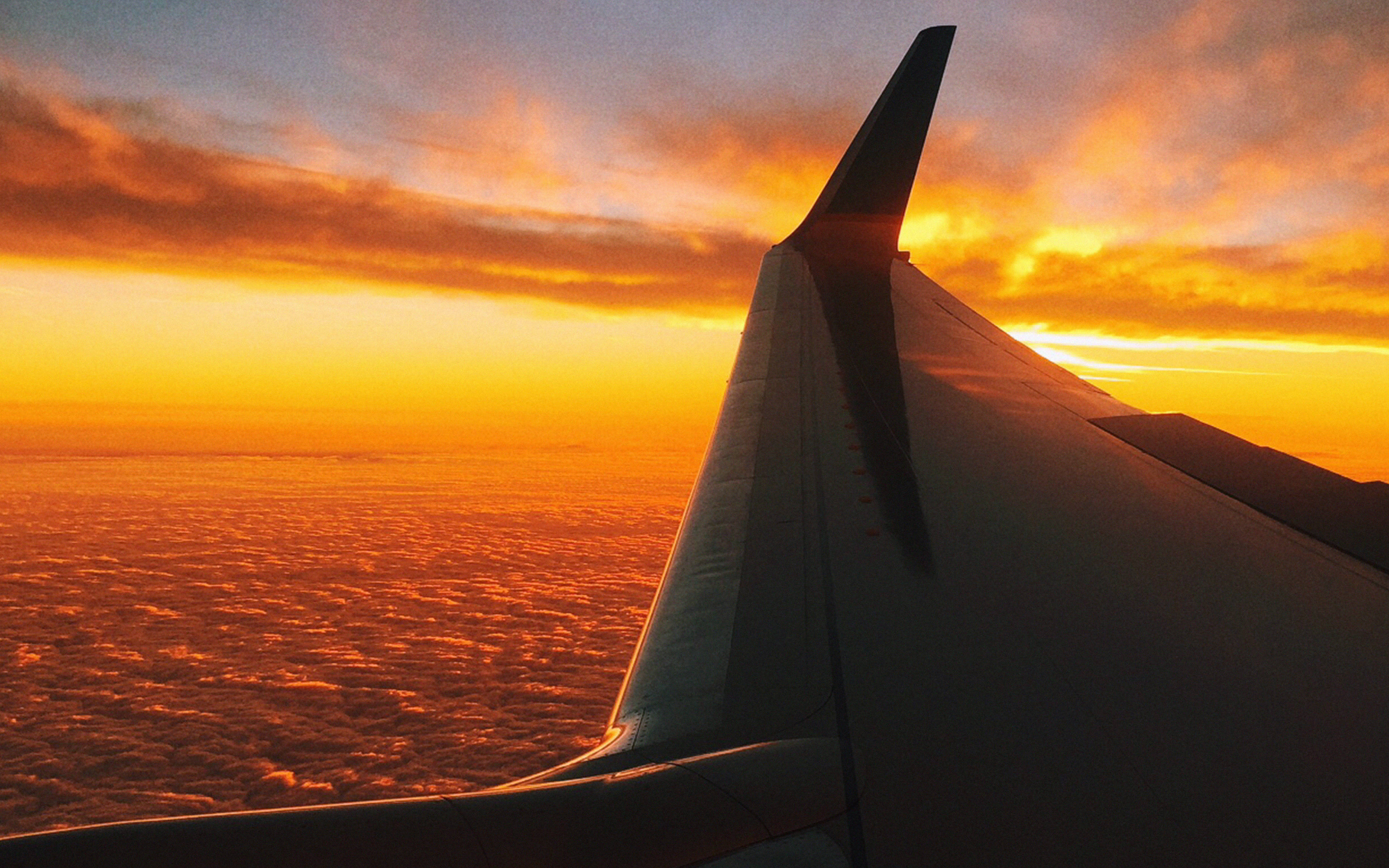 Airplane Wing, fiery orange sunset, endless cloud seas, 4K Desktop Wallpaper