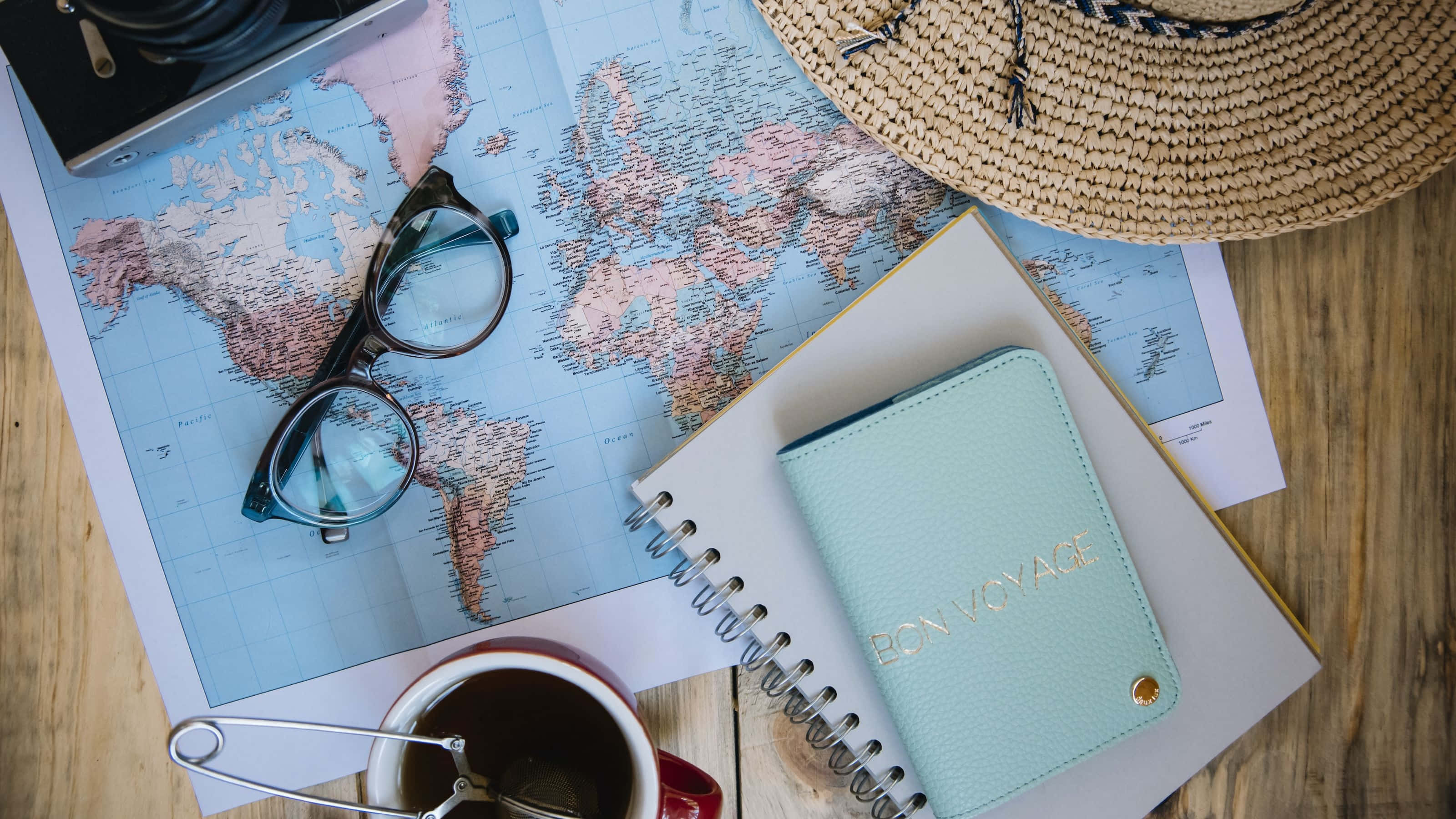 world map, straw hat, notebook with bon voyage, 2K Desktop Wallpaper