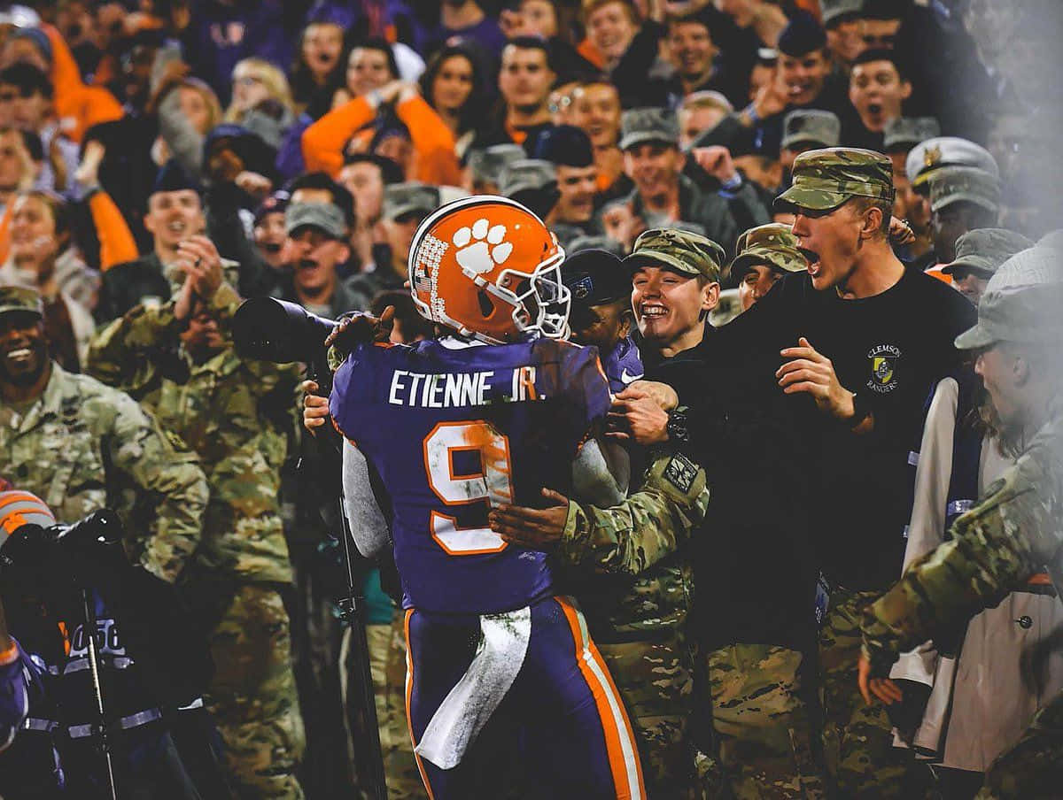 Travis Etienne Jr, number 9 helmet, purple uniform, SD Desktop Wallpaper