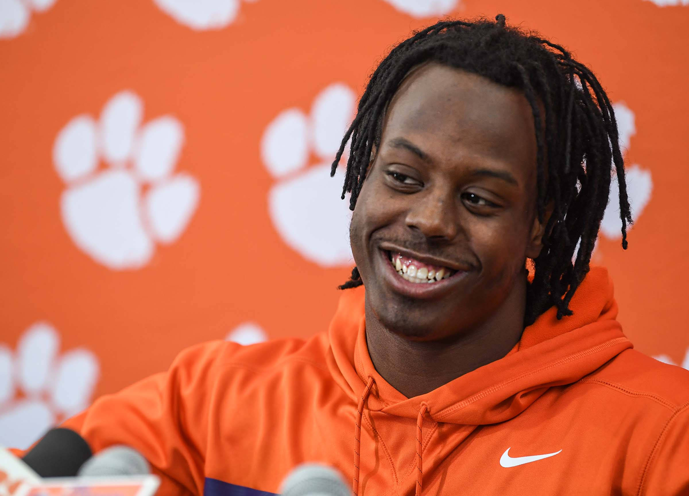 Travis Etienne Jr, orange hoodie, orange backdrop, Full HD Desktop Wallpaper