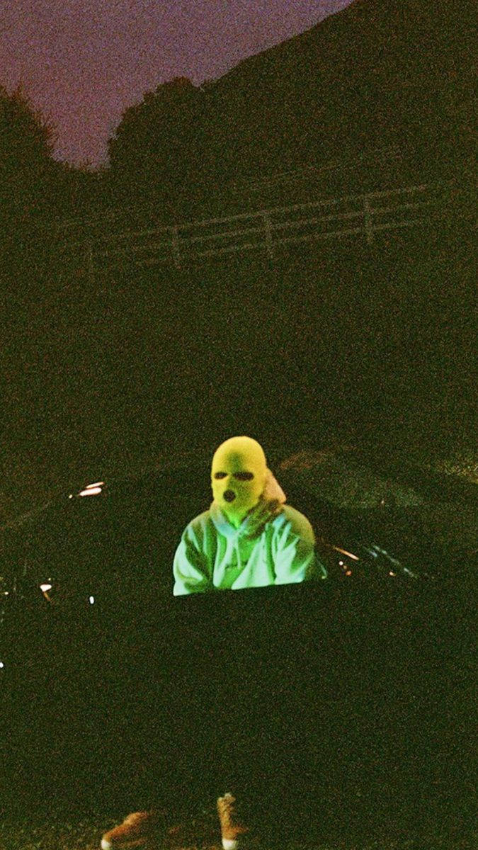 Travis Scott, glowing yellow mask, dark car, SD Phone Wallpaper