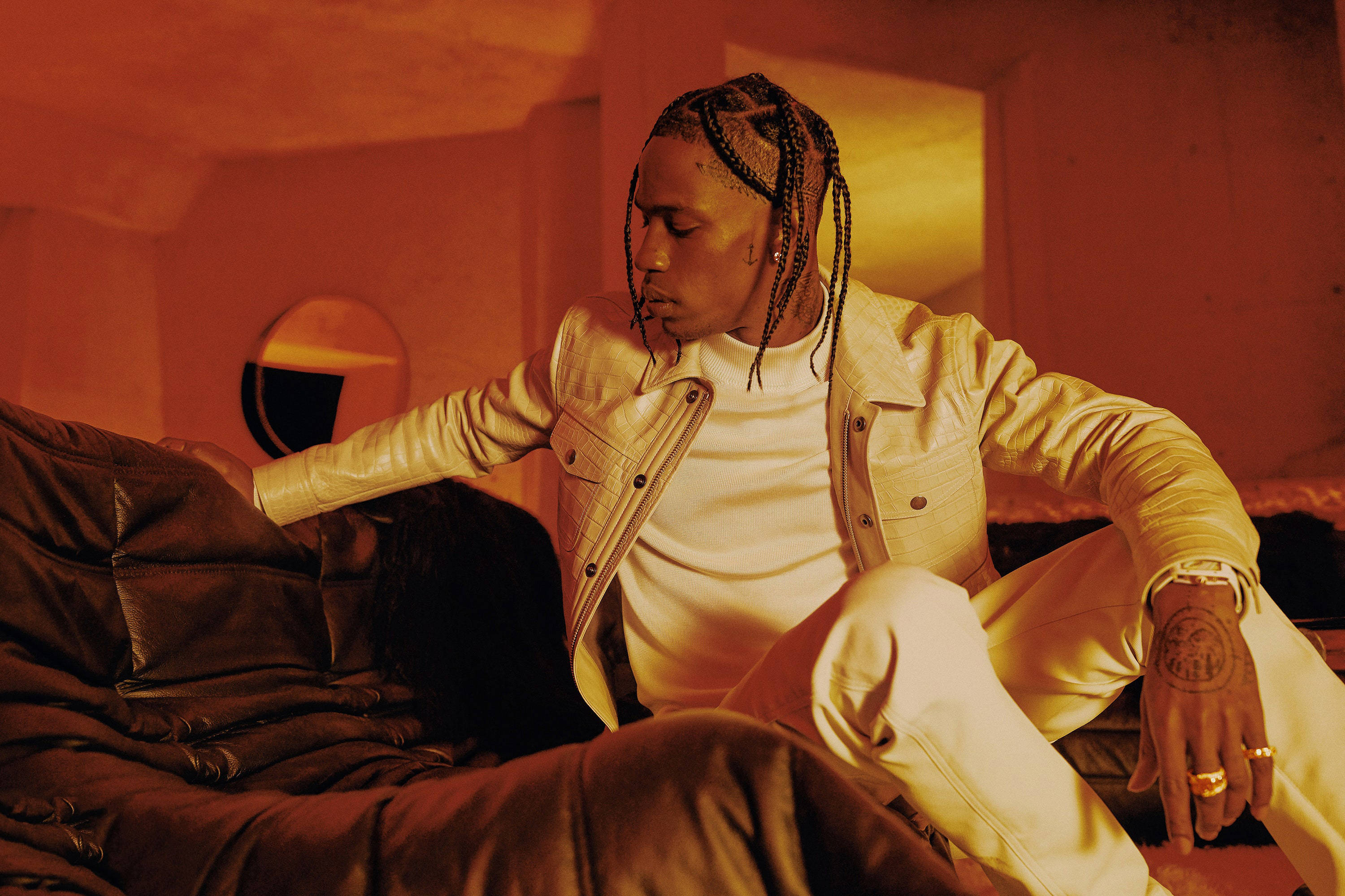 Travis Scott, cream leather jacket, dark leather couch, 2K Desktop Wallpaper