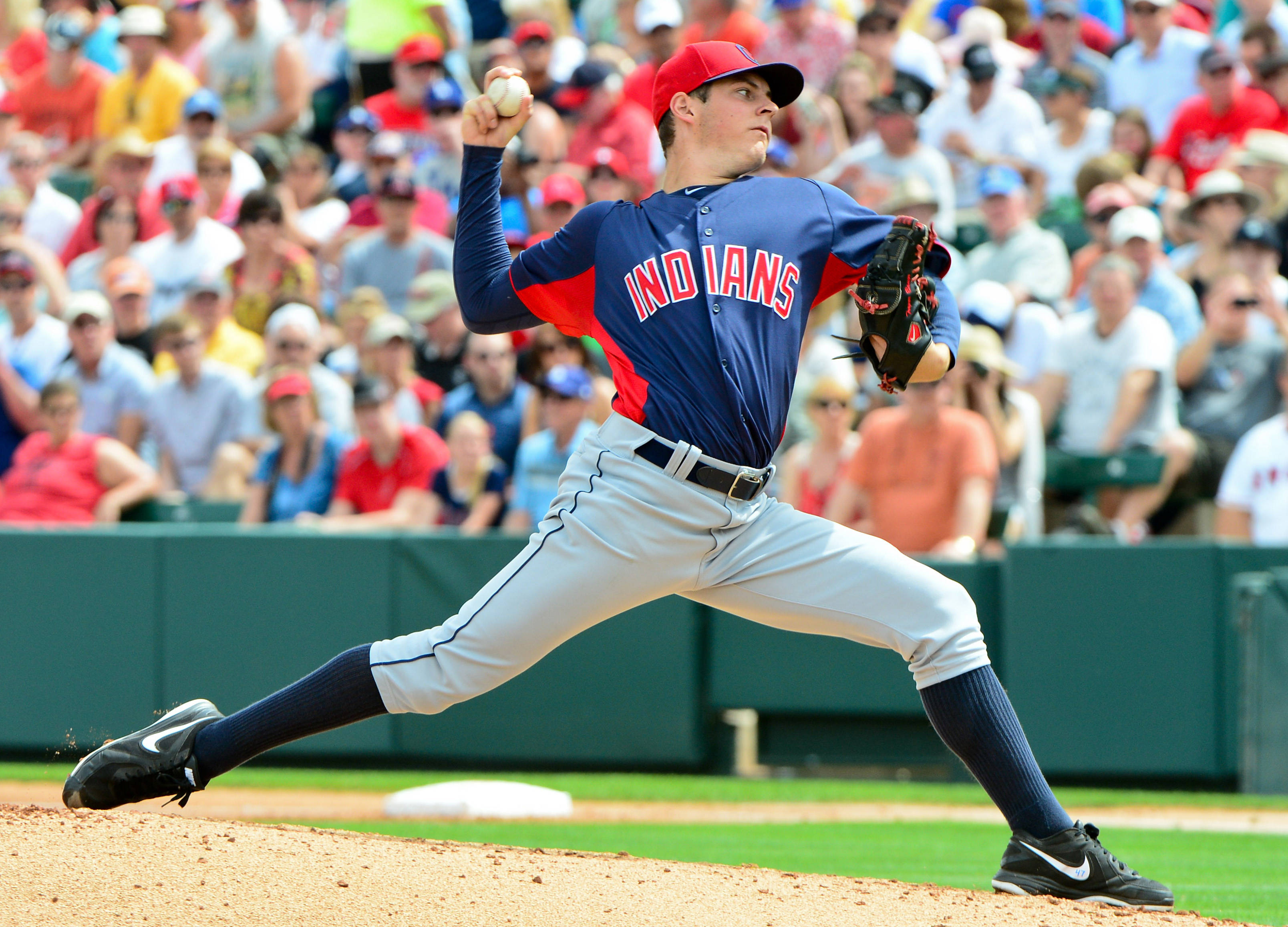 Trevor Bauer, blue and red Indians uniform, sunlit field, 2K Desktop Wallpaper