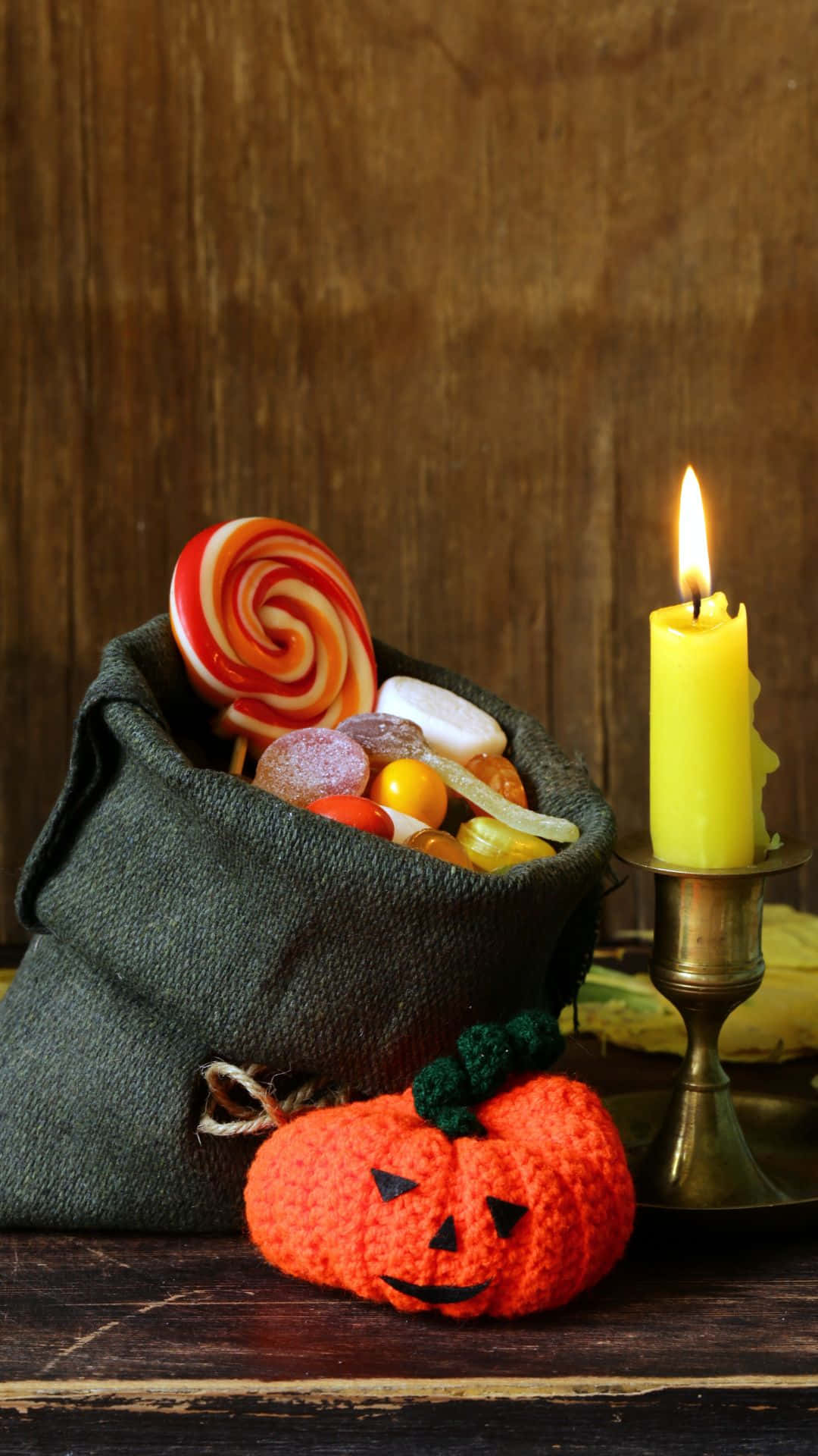 Trick Or Treat Bags, crocheted pumpkin, lit yellow candle, Full HD Phone Wallpaper
