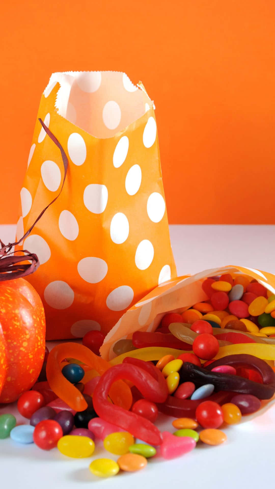 Trick-or-Treat bags, orange polka-dot, gummy worms, Full HD Phone Wallpaper