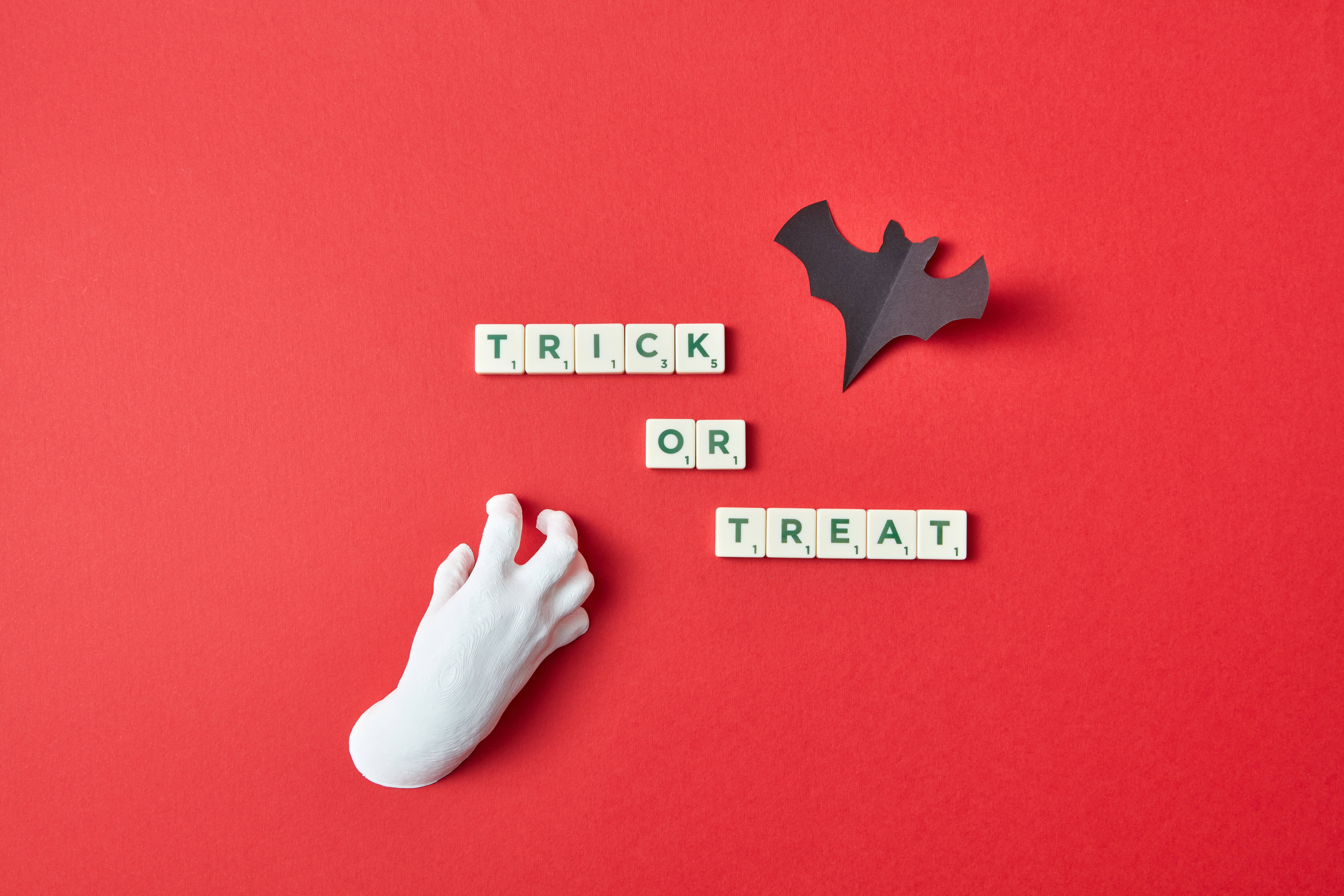 Scrabble tiles, trick or treat, bold red background, 8K Desktop Wallpaper
