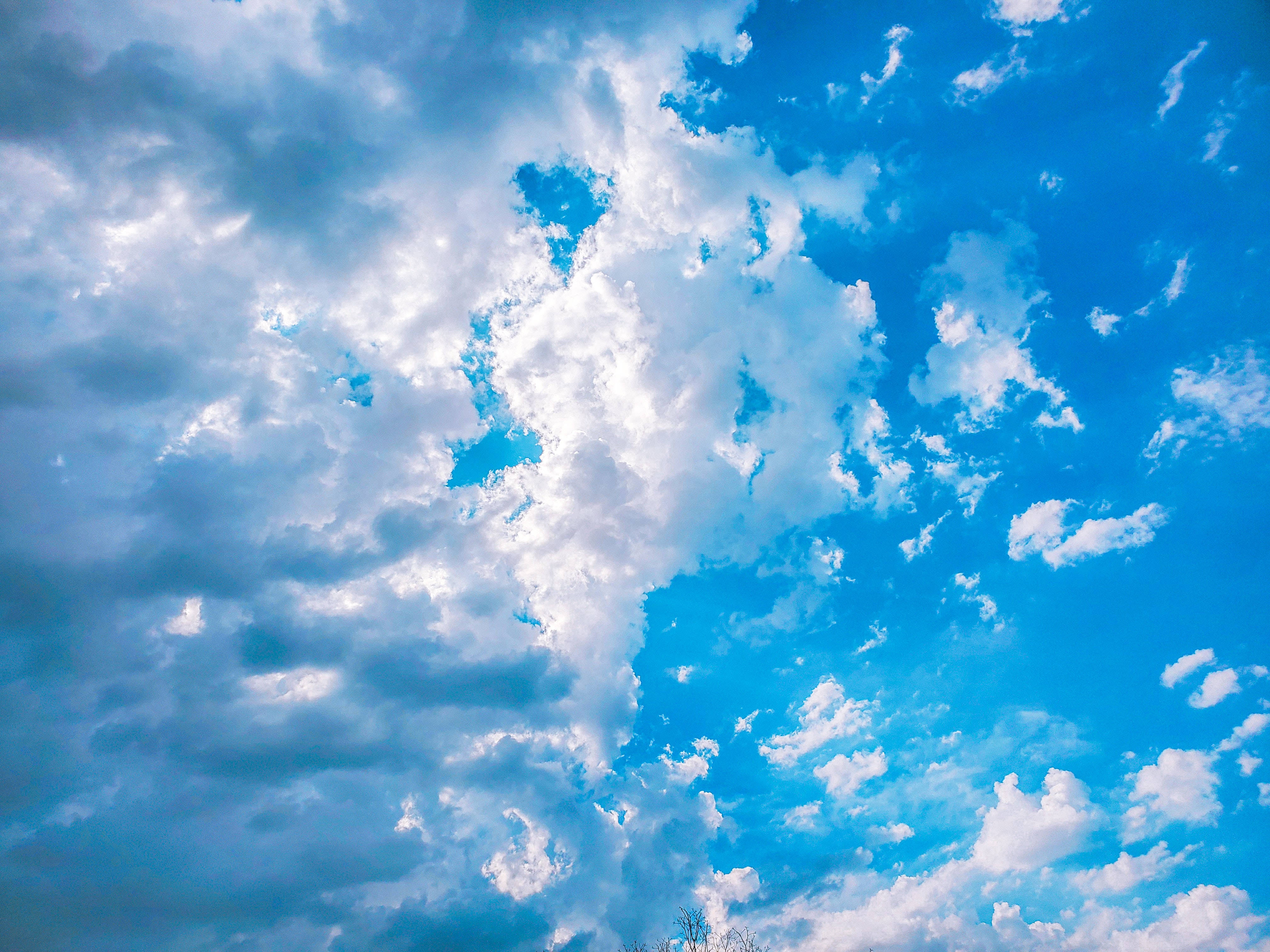 fluffy white clouds, vibrant blue sky, soft shadows, 4K Desktop Wallpaper