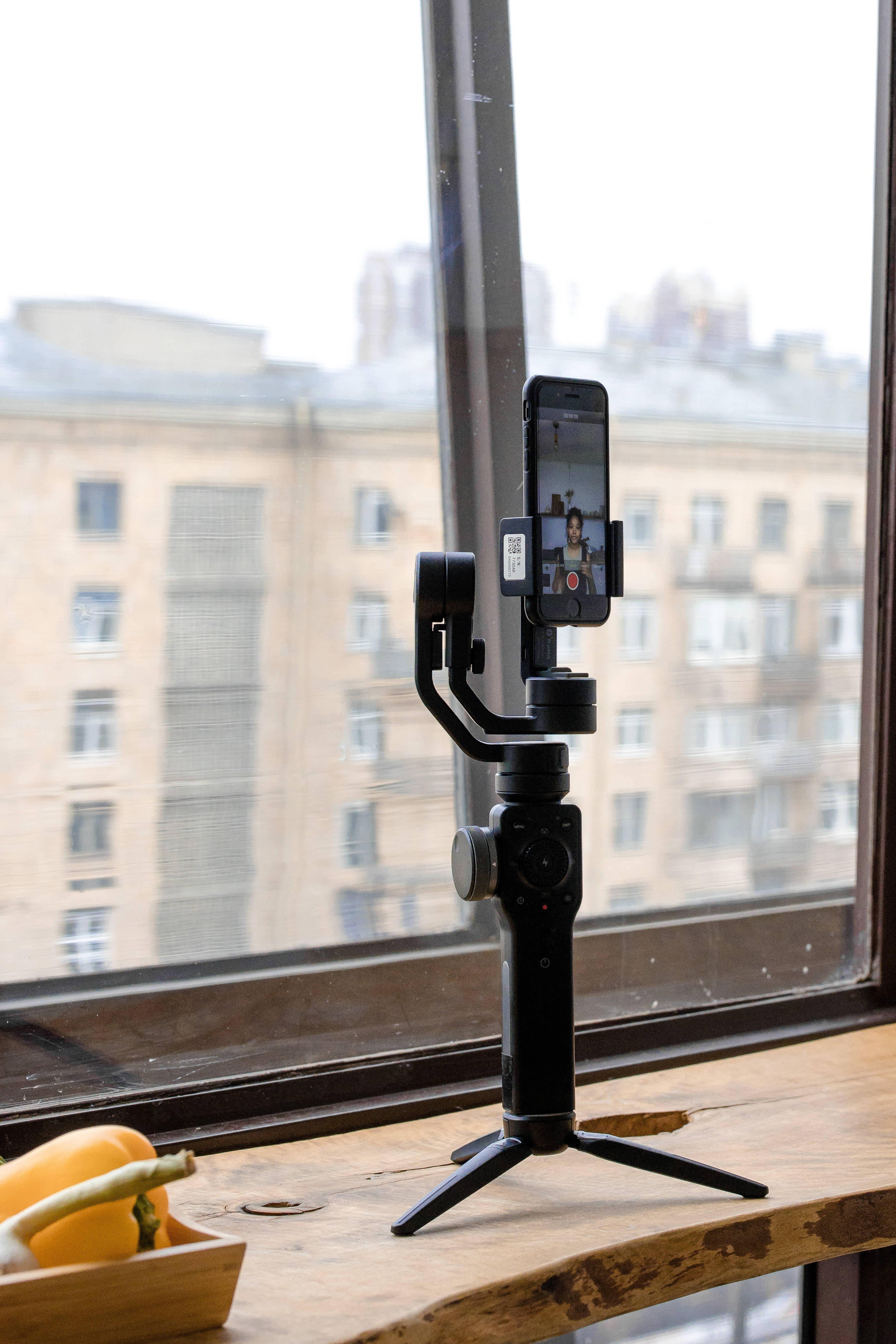 iPhone, black gimbal stabilizer, wooden windowsill, 4K Phone Wallpaper