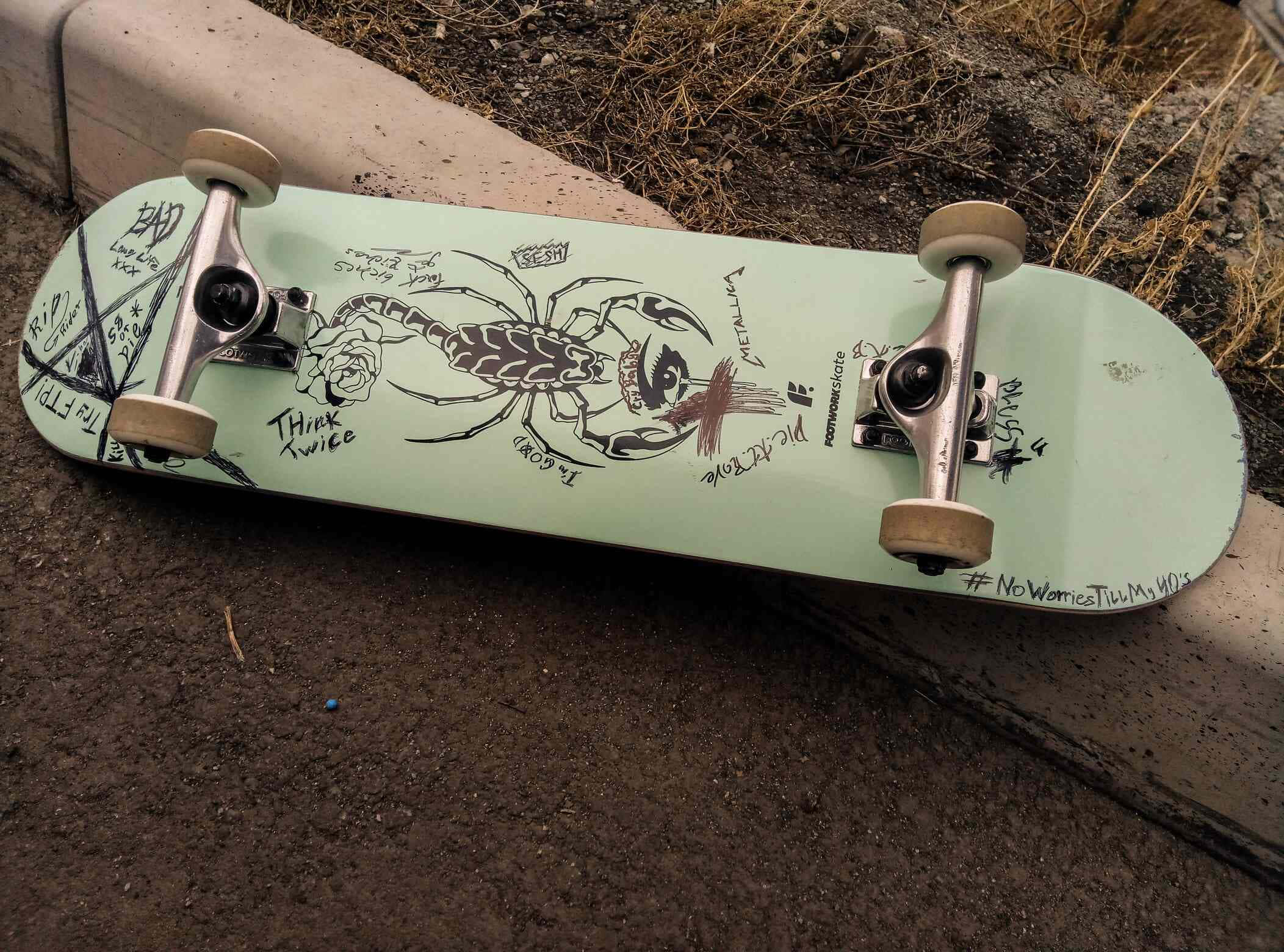 mint green skateboard, black scorpion graphic, graffiti-style text, Full HD Desktop Wallpaper