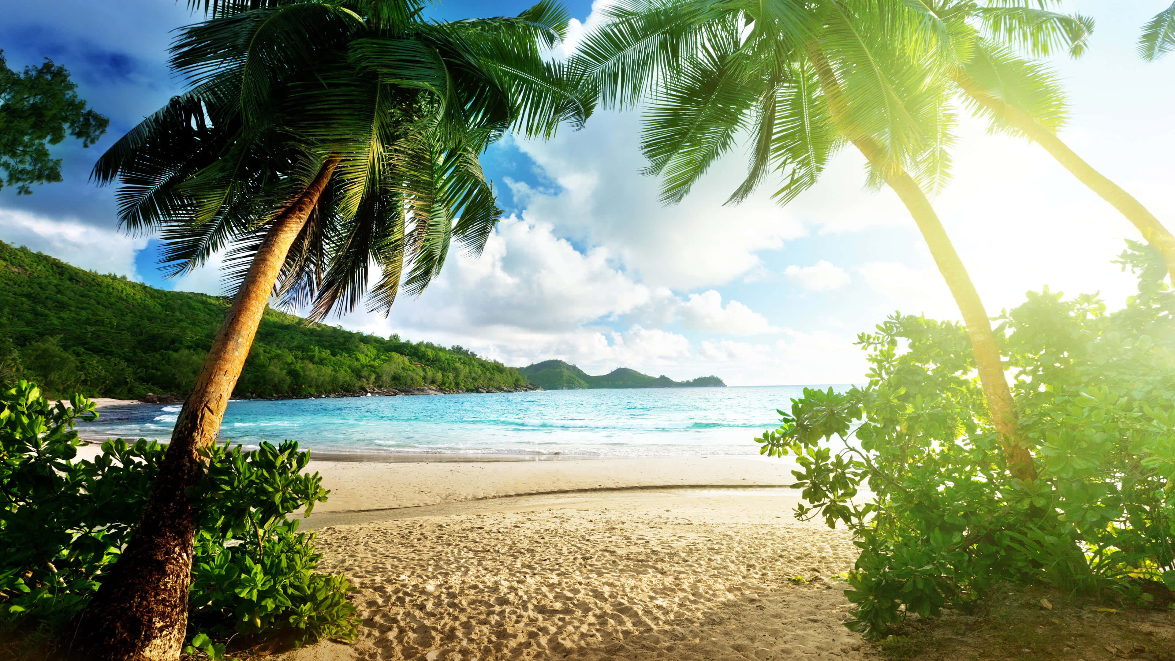 Tropical Beach, turquoise water, lush green hills, 4K Desktop Wallpaper