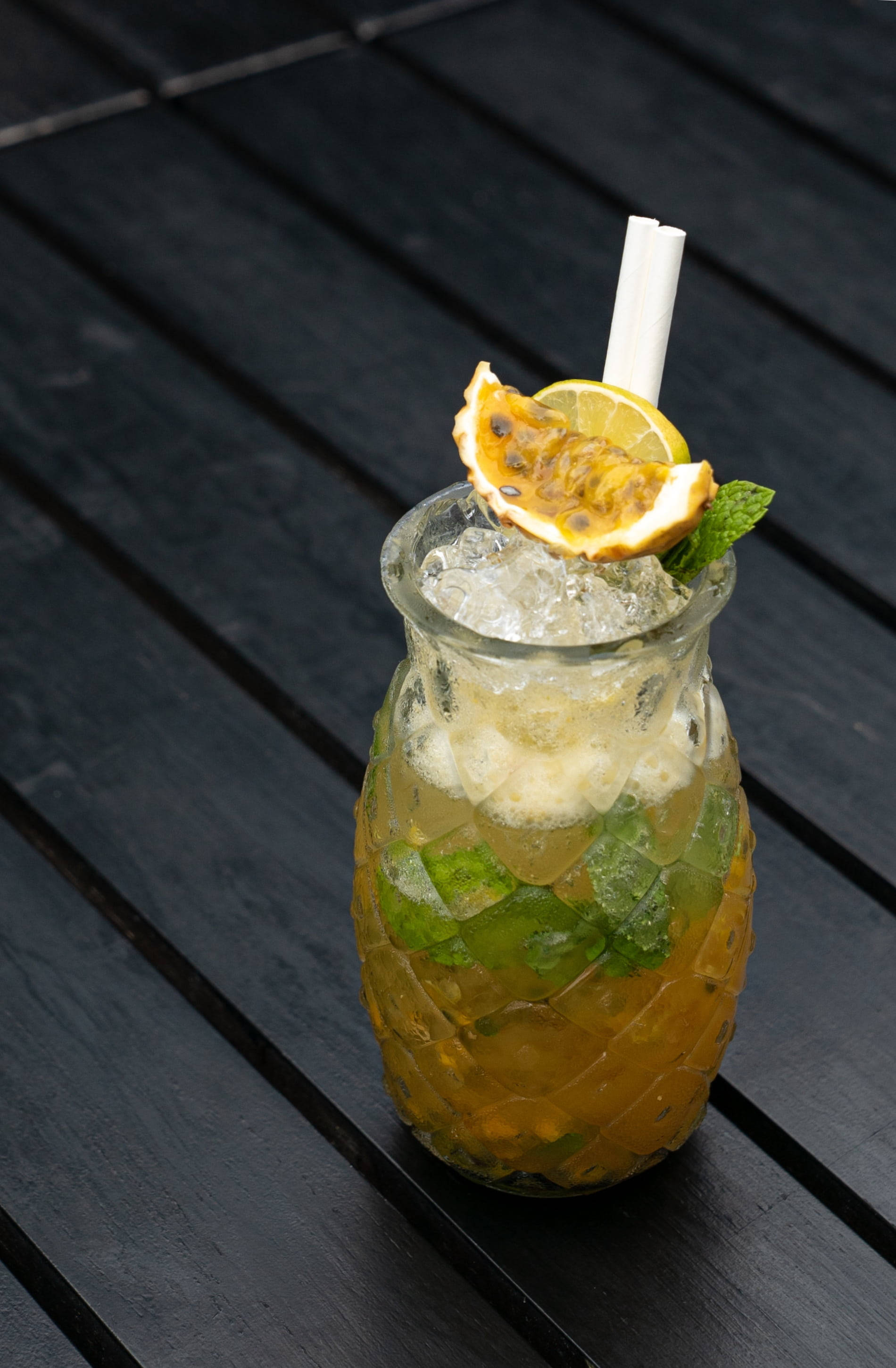 Passion Fruit And Lemon Mojito, pineapple-shaped glass, dark wooden table, 2K Phone Wallpaper