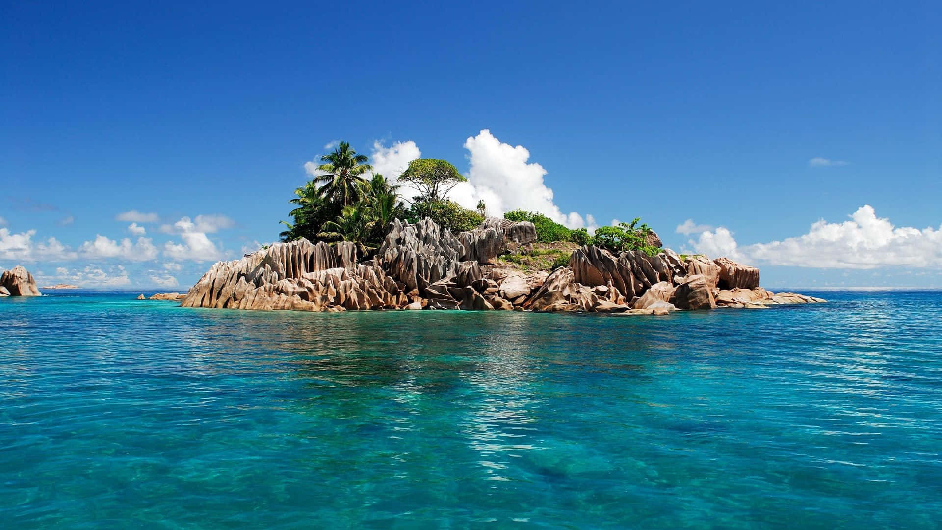 Tropical Island, pink granite rocks, lush green palms, Full HD Desktop Wallpaper