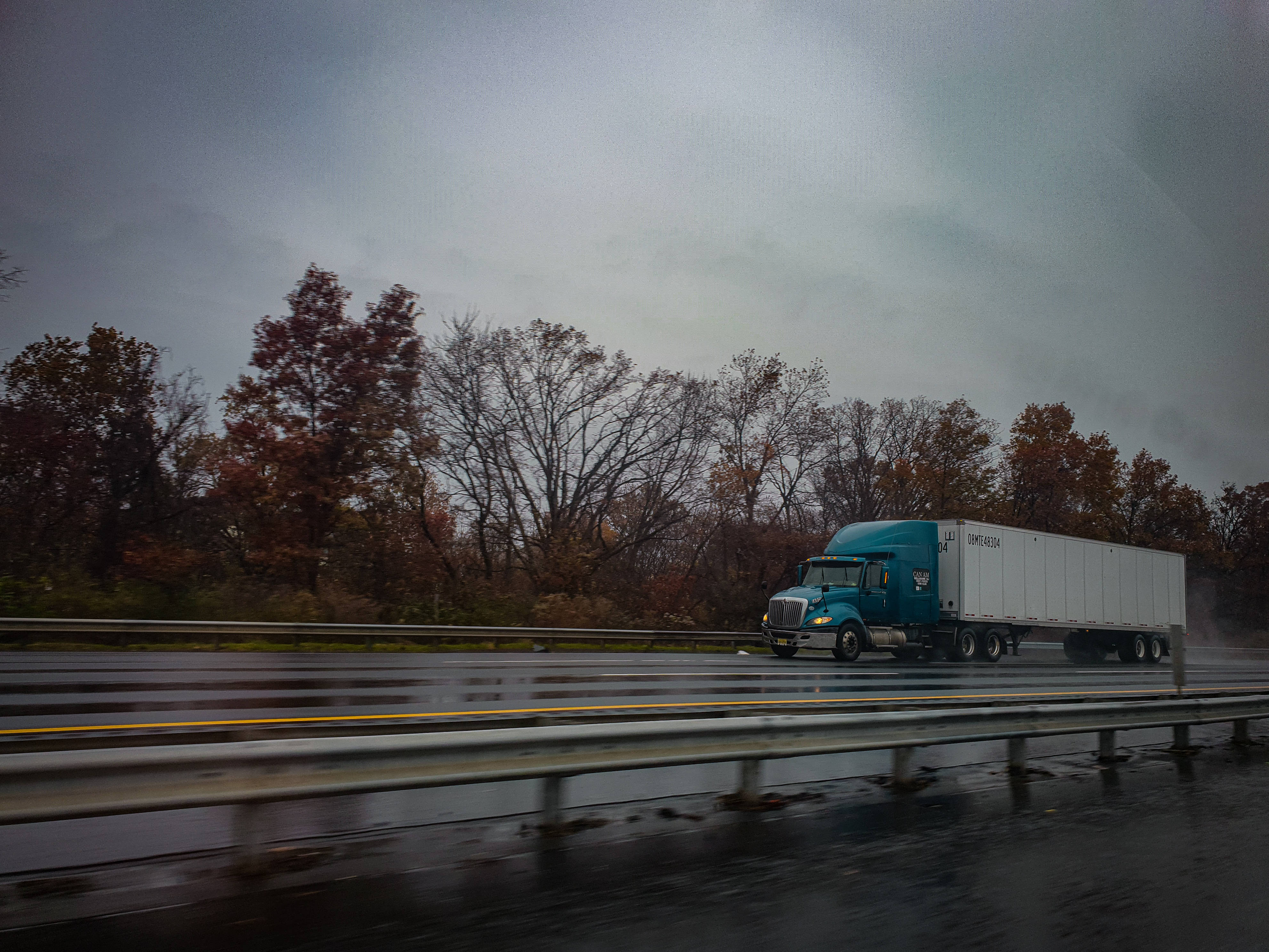 teal semi-truck, white trailer, wet highway, 4K Desktop Wallpaper