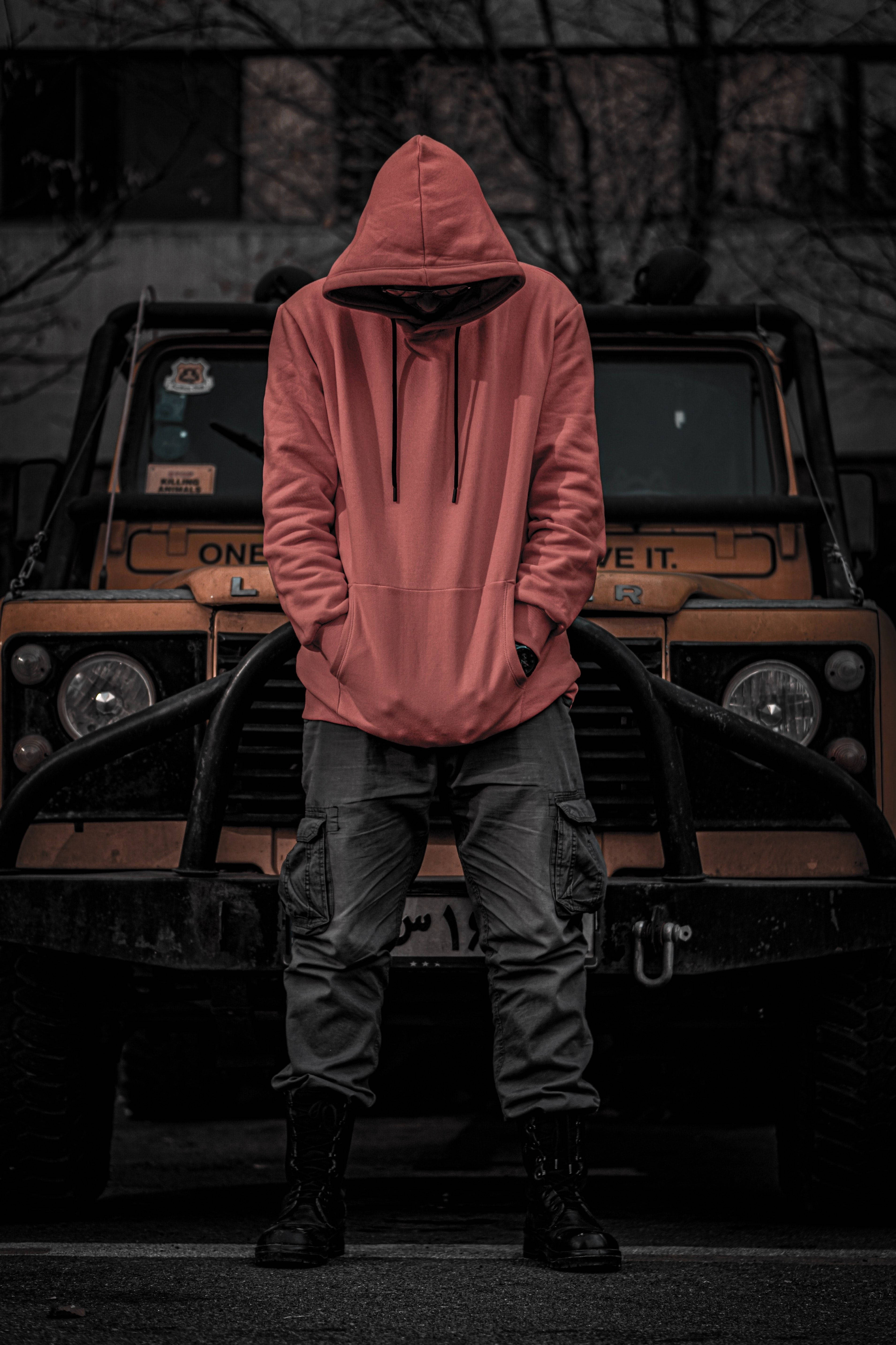 red hoodie, rugged orange truck, dim lighting, 5K Phone Wallpaper