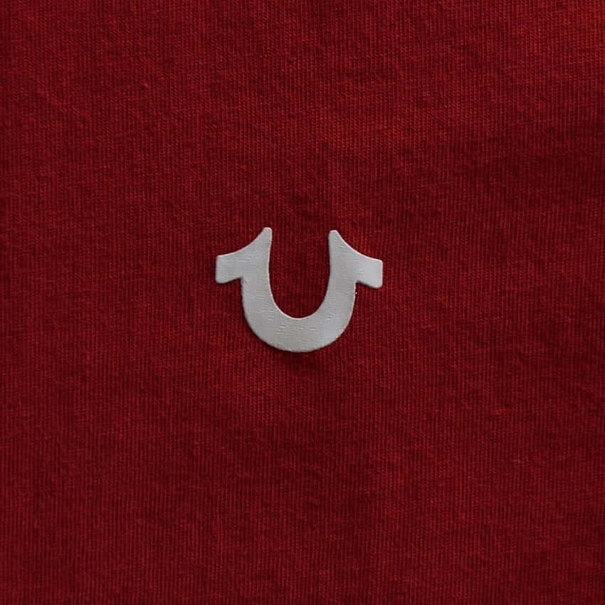 True Religion, silver U-shaped metal piece, textured deep red fabric, SD Desktop Wallpaper
