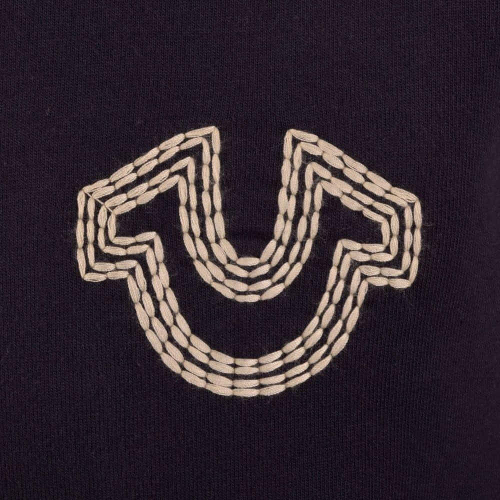 True Religion, cream-colored stitched smiley face, dark navy knit fabric, SD Desktop Wallpaper