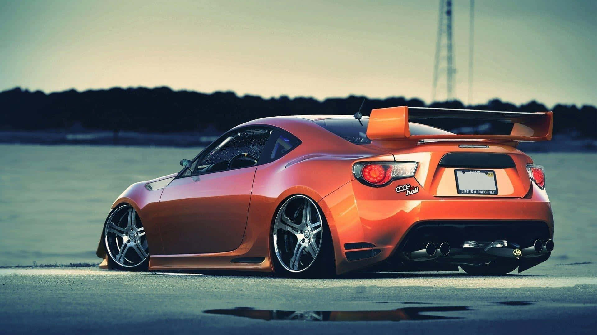 vibrant orange sports car, large rear wing, wet asphalt surface, Full HD Desktop Wallpaper