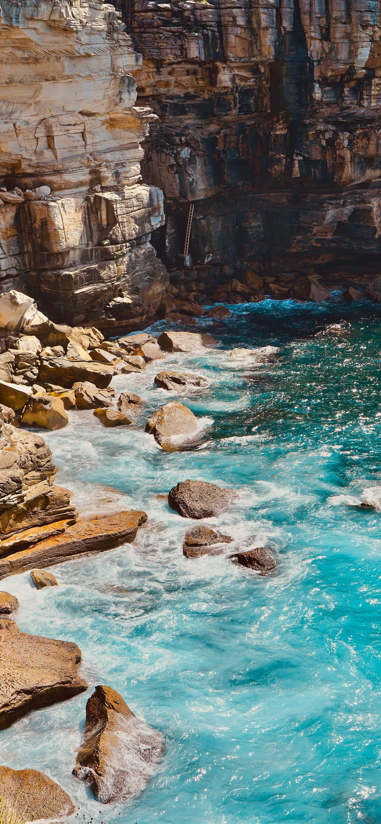turquoise iPhone, golden cliffs, sunlit coastal cove, 2K Phone Wallpaper