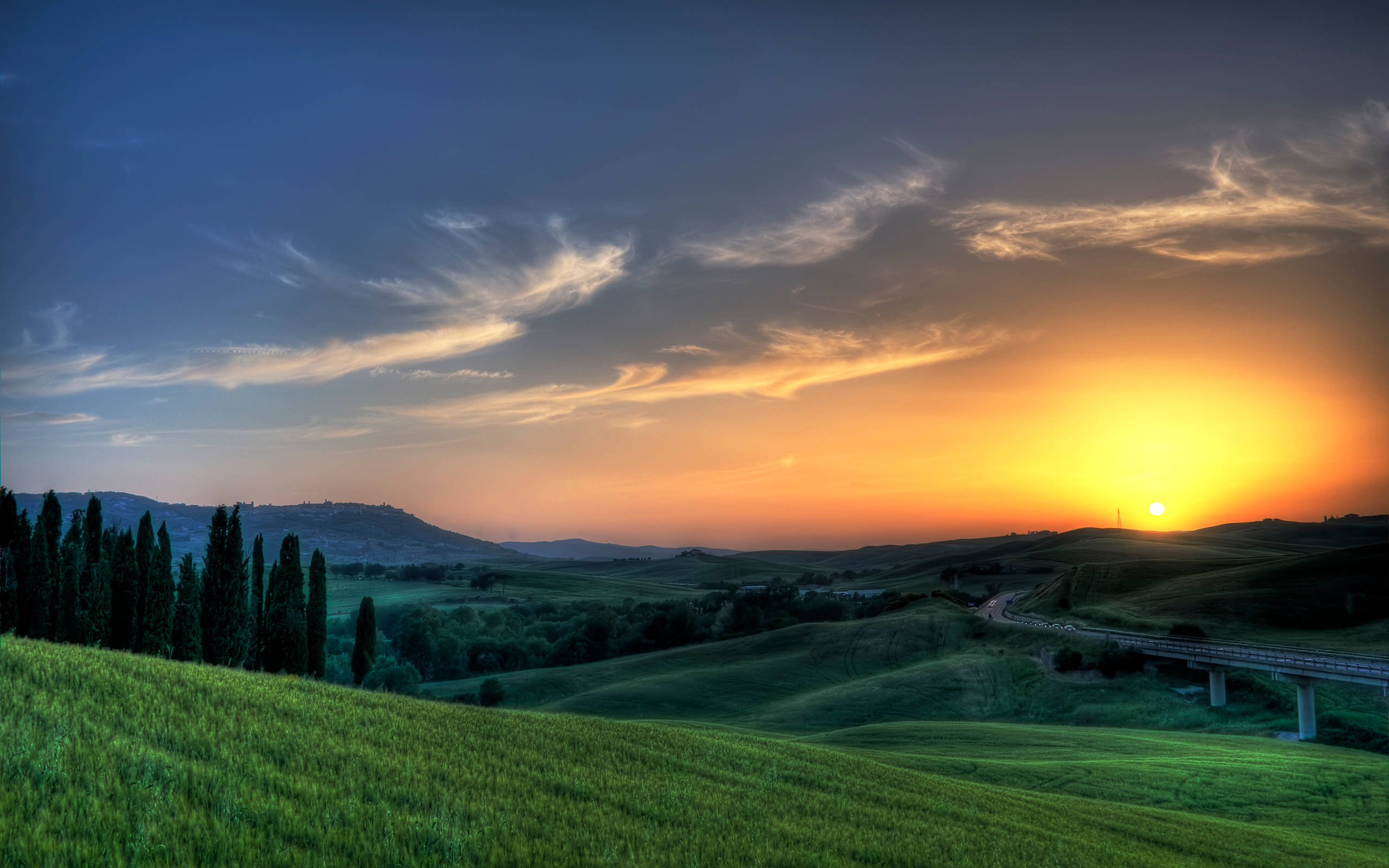 Stunning Sunset Of Hilly Tuscany, rolling green hills, cypress trees, 2K Desktop Wallpaper
