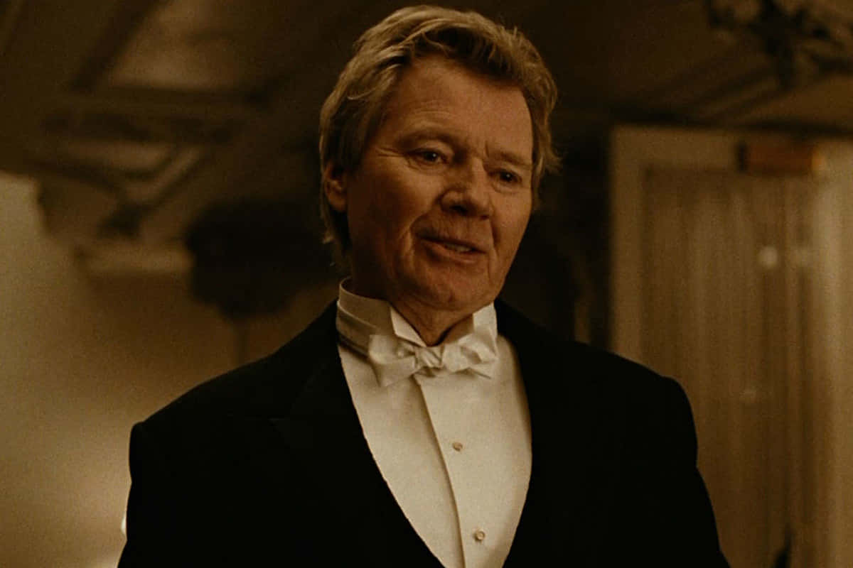black tuxedo, white bow tie, warmly lit room, SD Desktop Wallpaper