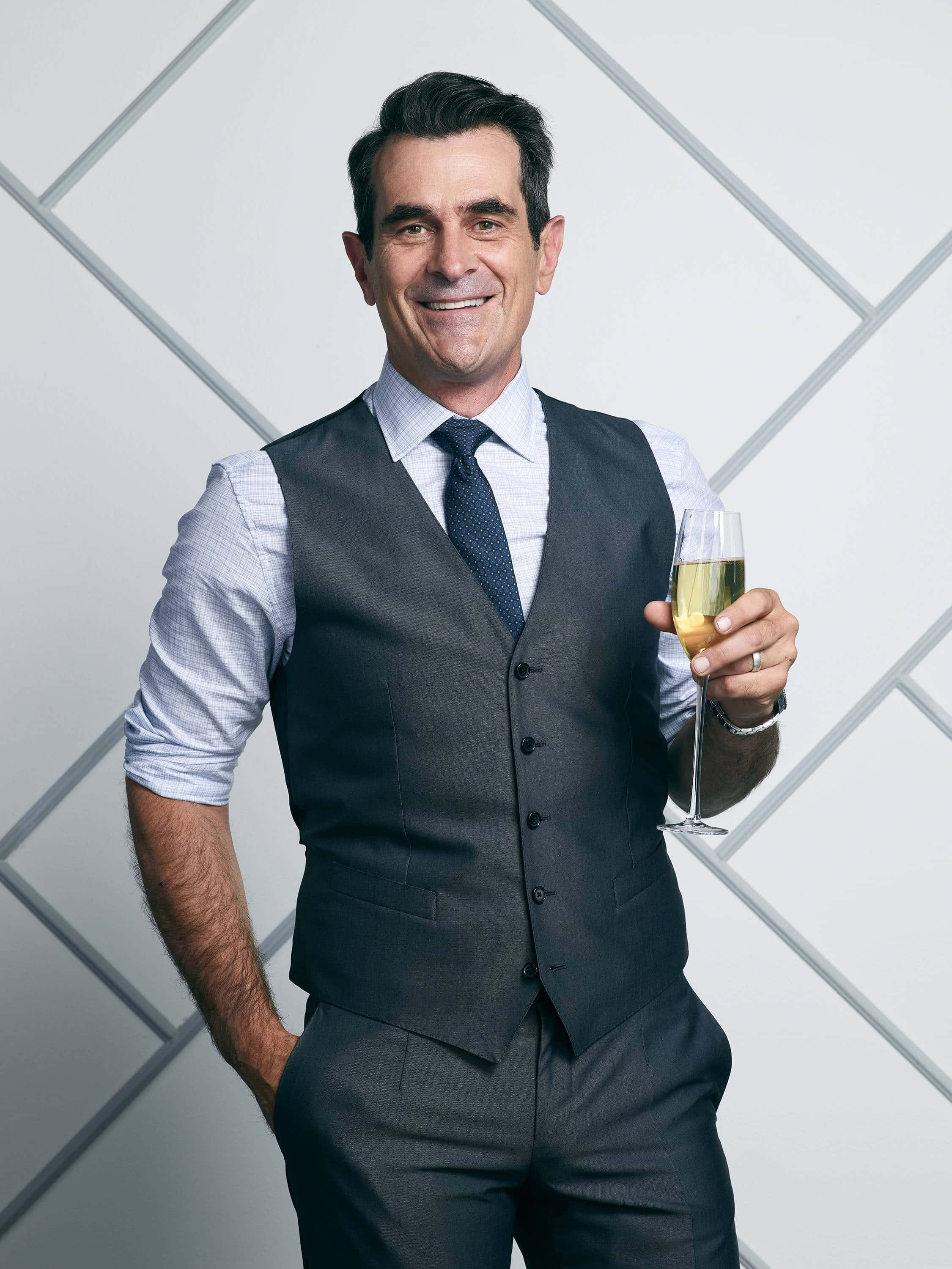 Ty Burrell, black suit and tie, geometric white wall, 2K Phone Wallpaper
