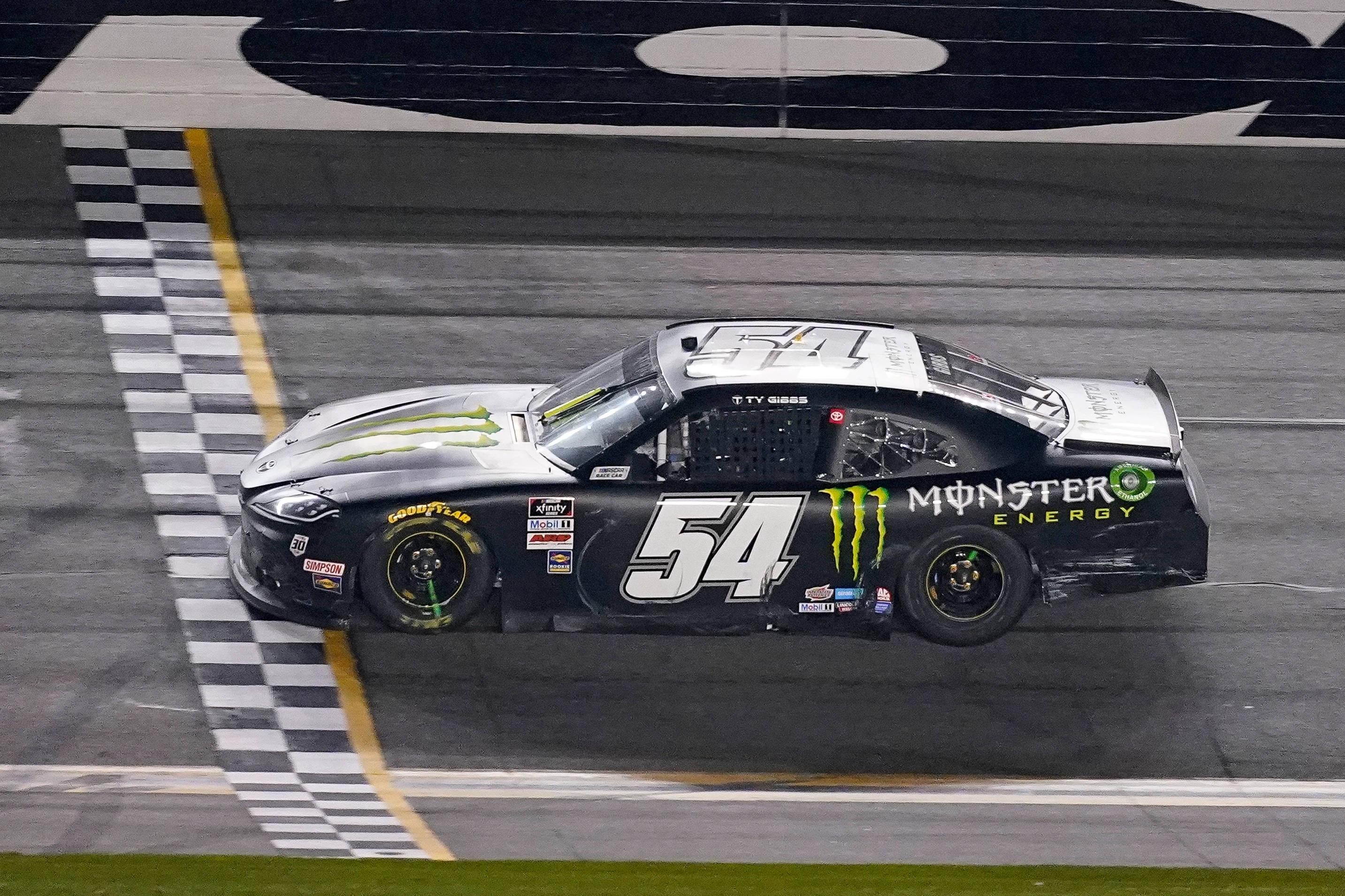 Ty Gibbs, black #54 Monster Energy NASCAR race car, checkered flag, 2K Desktop Wallpaper