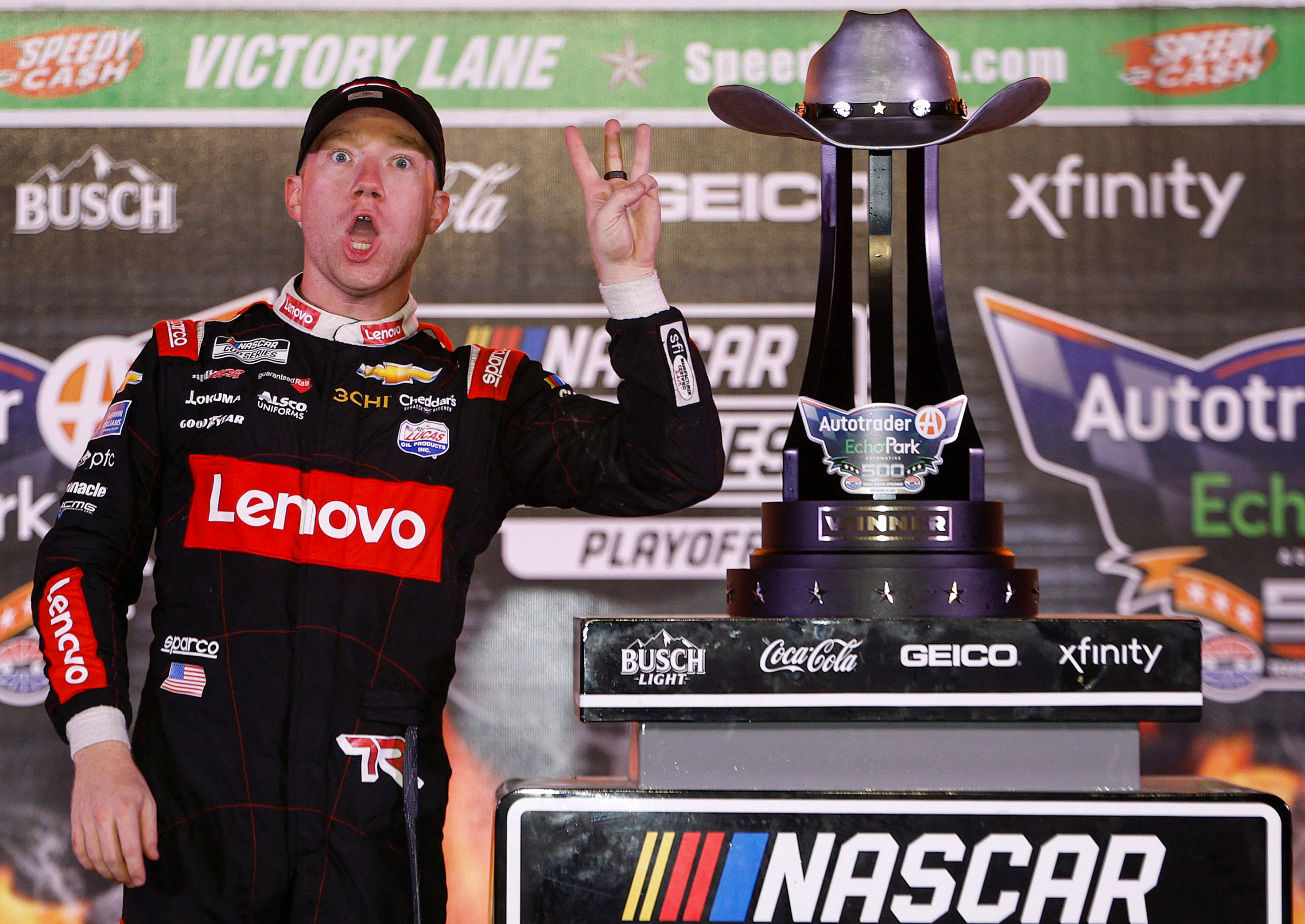Tyler Reddick, black racing suit, peace sign, 2K Desktop Wallpaper