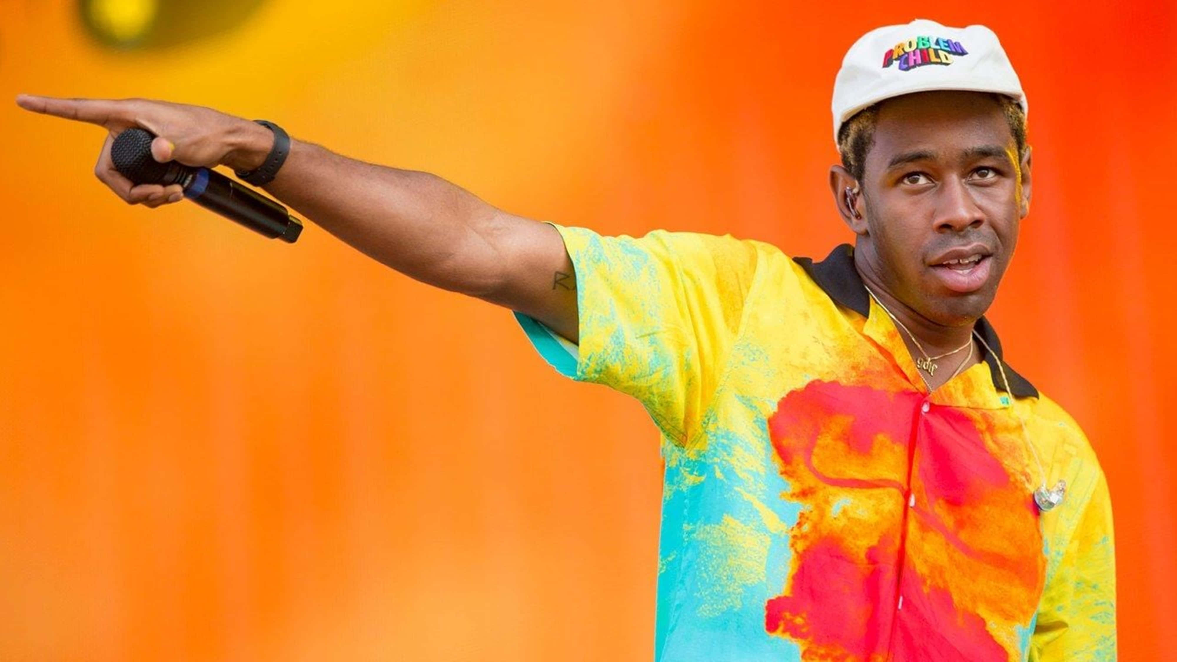 Tyler The Creator, vibrant tie-dye shirt, white cap, 4K Desktop Wallpaper