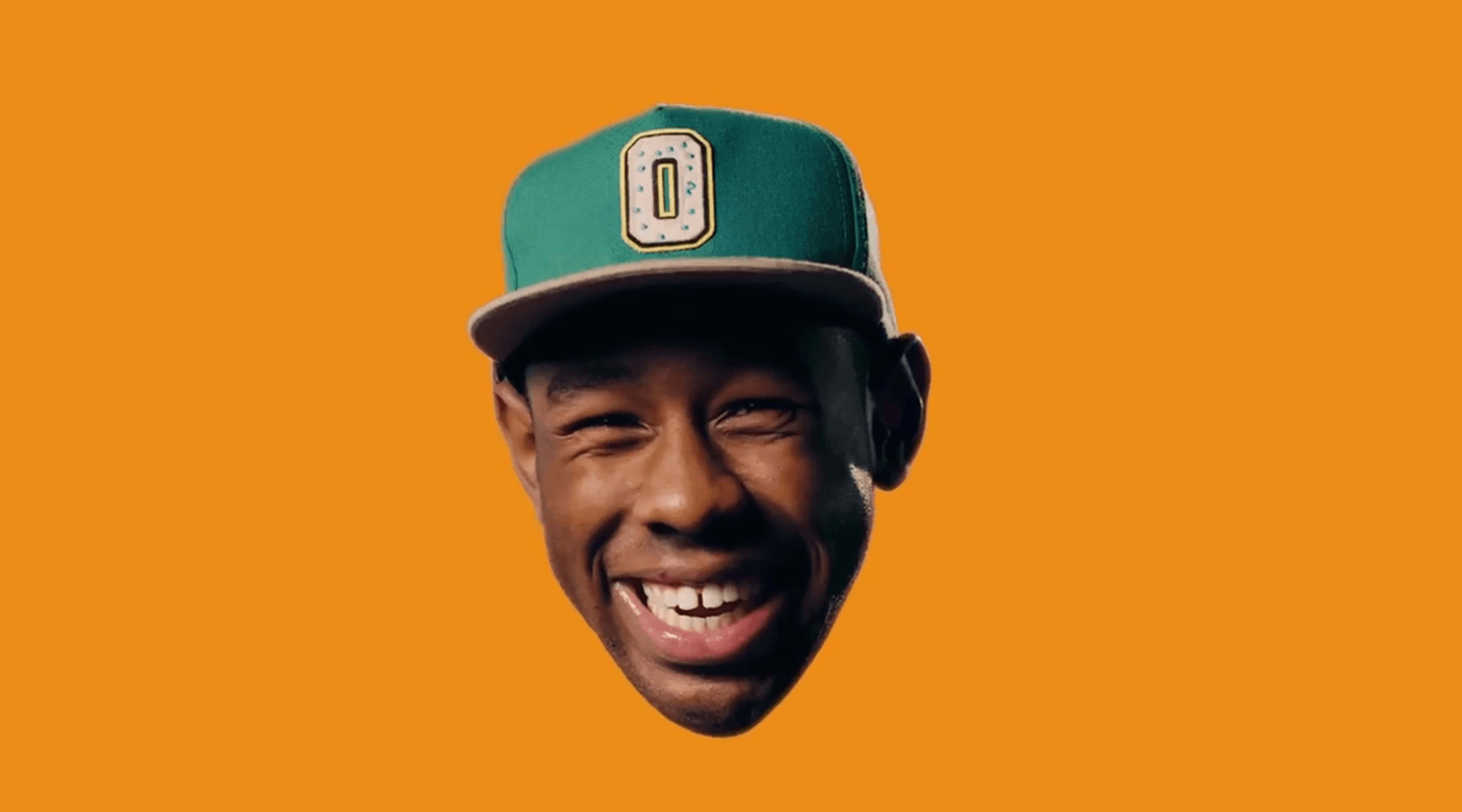 Tyler The Creator, green Oregon Ducks cap, solid orange background, 4K Desktop Wallpaper