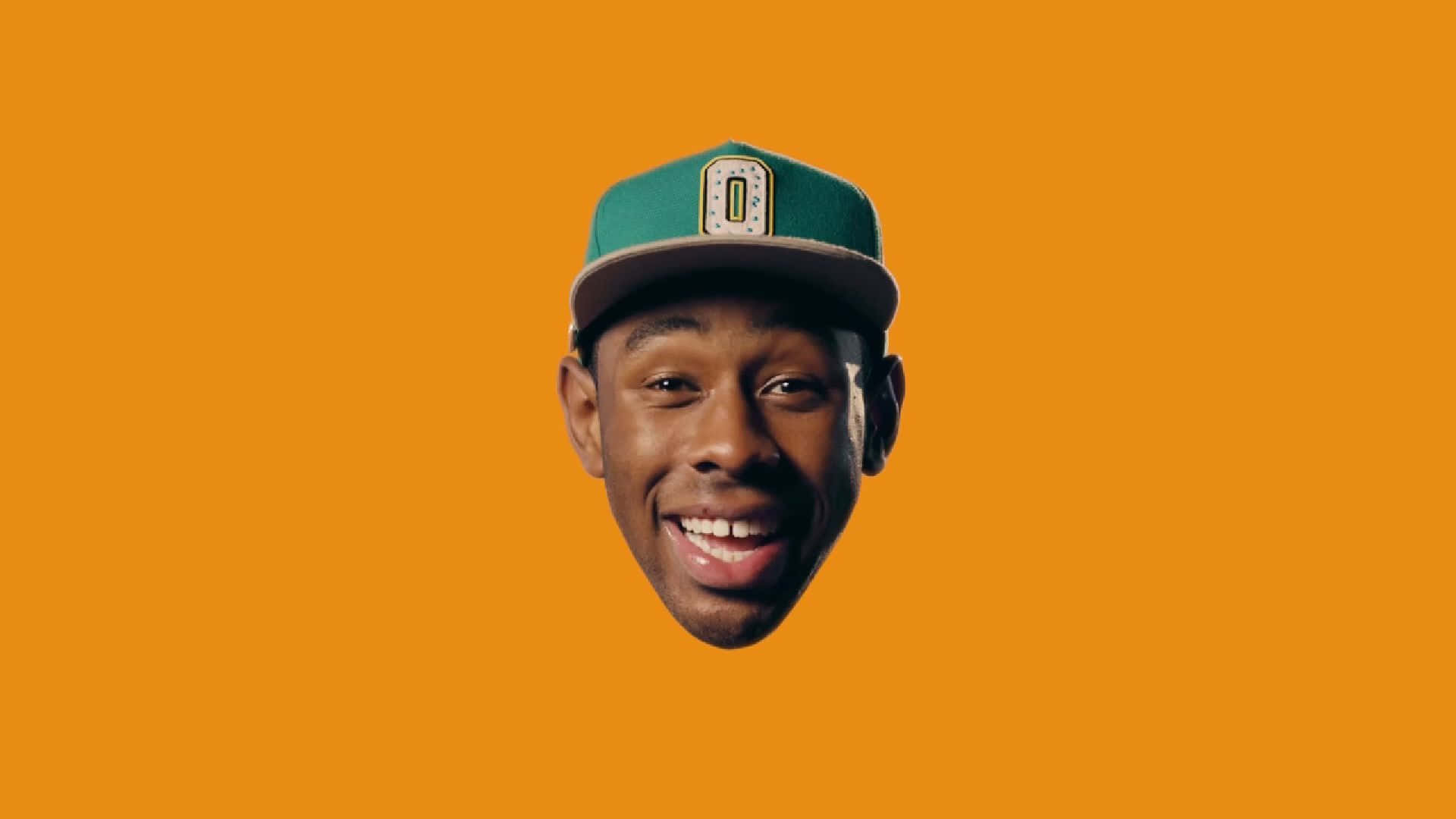 Tyler The Creator, green cap, orange background, Full HD Desktop Wallpaper