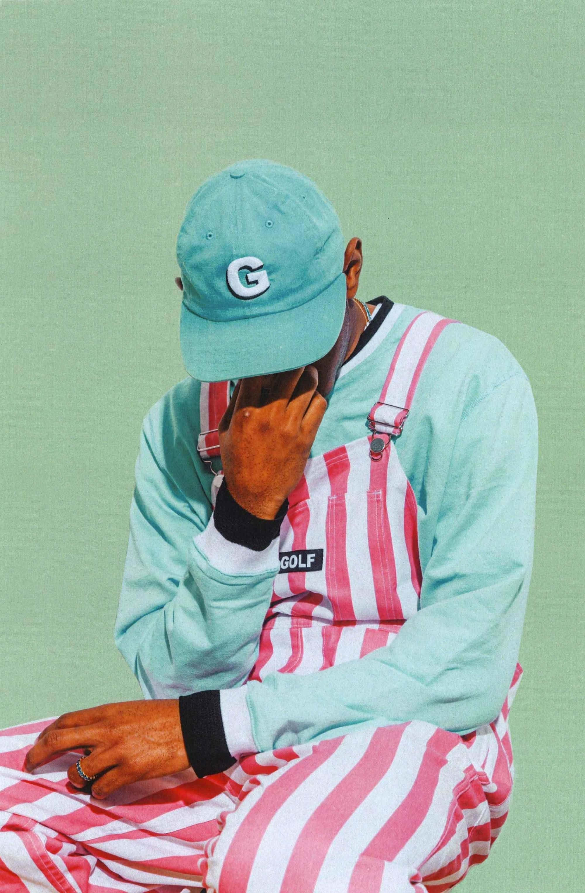 Pastel Tyler The Creator PFP, mint green cap, pink striped overalls, 2K Phone Wallpaper