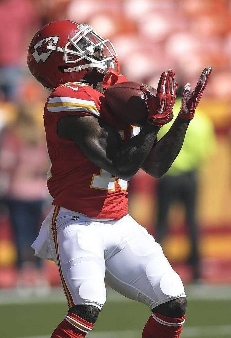 Tyreek Hill, red and white uniform, catches a ball mid-air, SD Phone Wallpaper