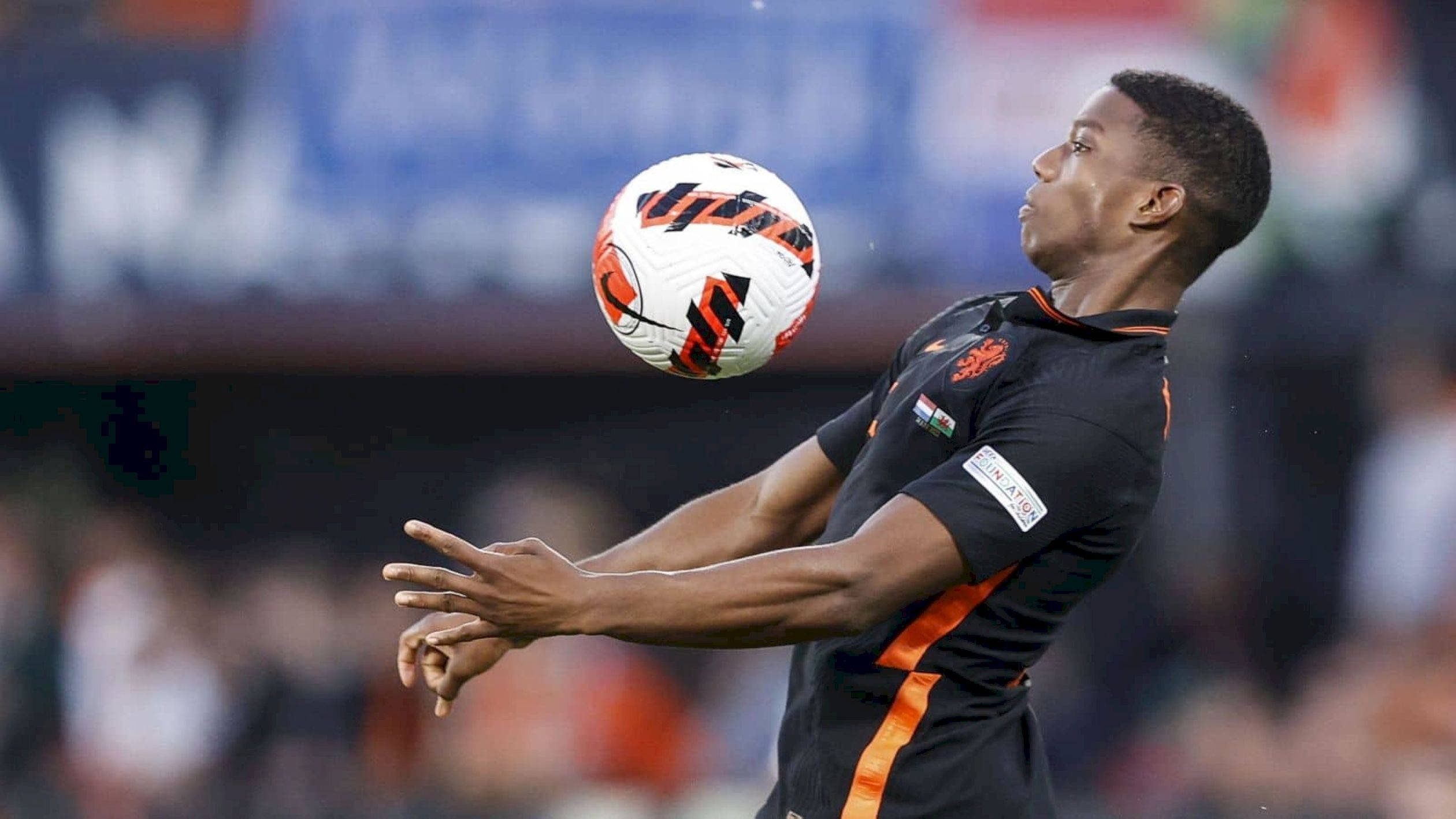 Tyrell Malacia, black and orange jersey, white and orange ball, Full HD Desktop Wallpaper
