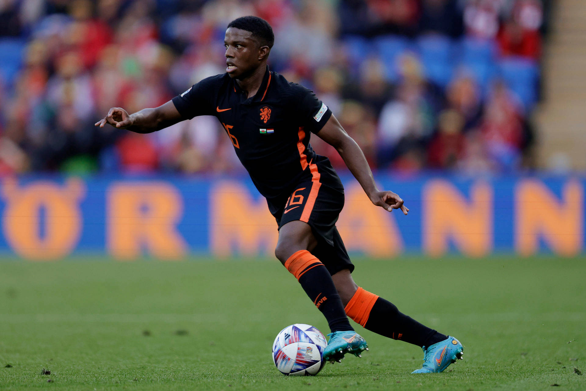 Tyrell Malacia, black and orange kit, colorful ball, Full HD Desktop Wallpaper