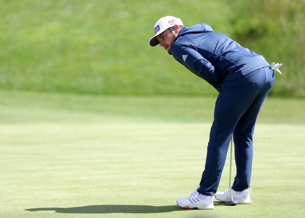 Tyrrell Hatton, blue tracksuit, sunlit green grass course, SD Desktop Wallpaper
