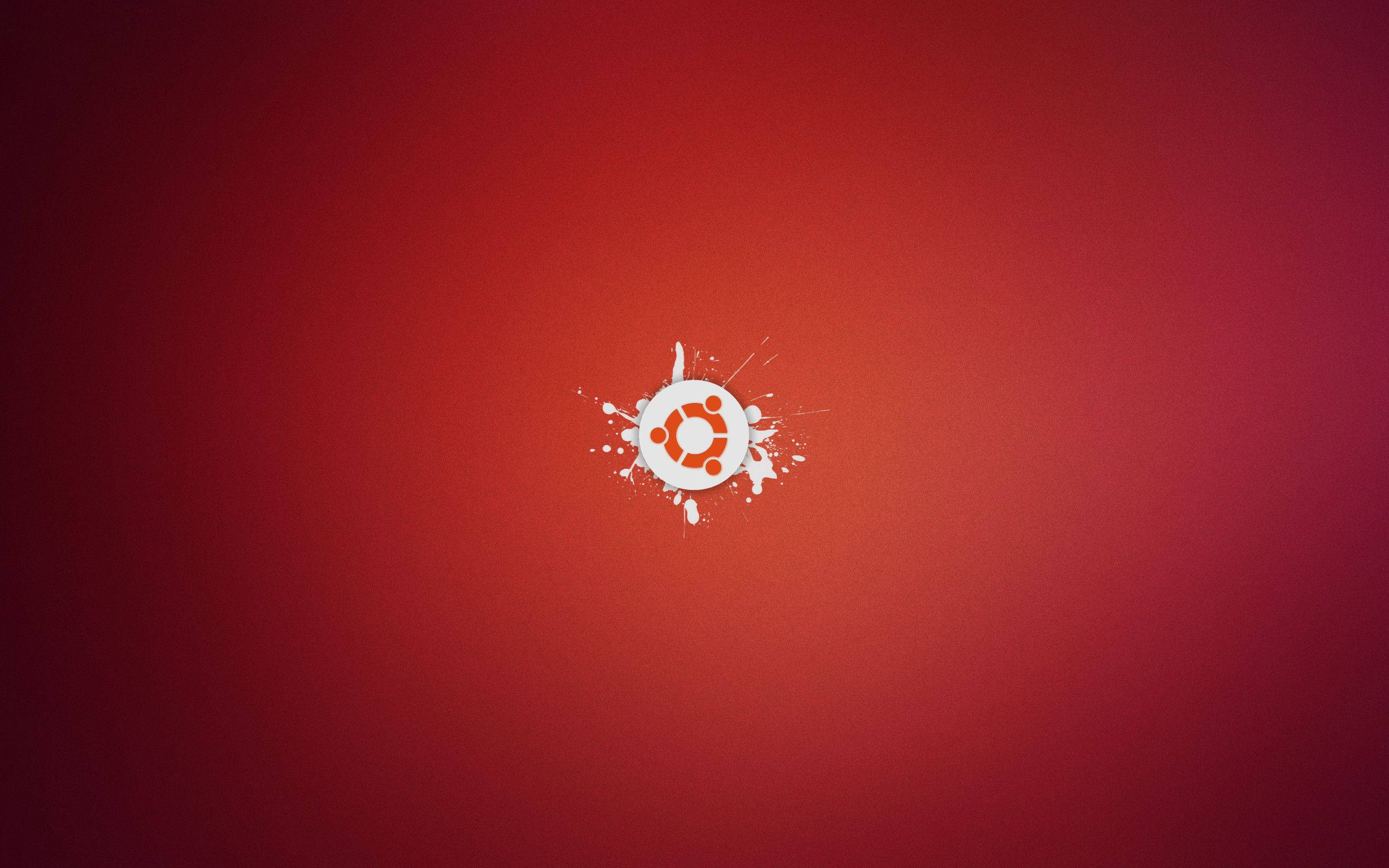 Ubuntu logo, gradient red background, white paint splatter effects, 2K Desktop Wallpaper