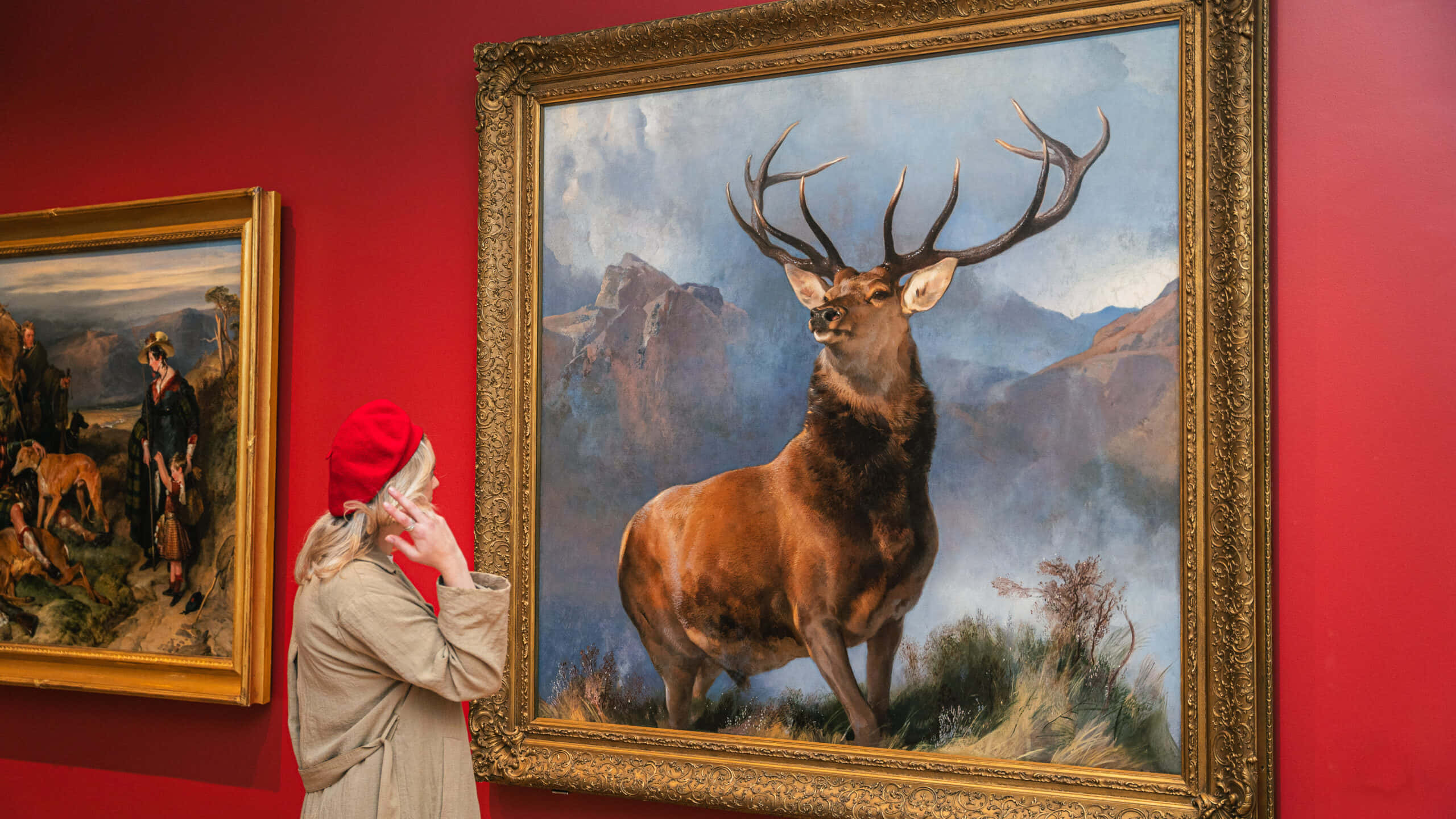 stag painting, mountainous landscape, vivid red gallery wall, 2K Desktop Wallpaper