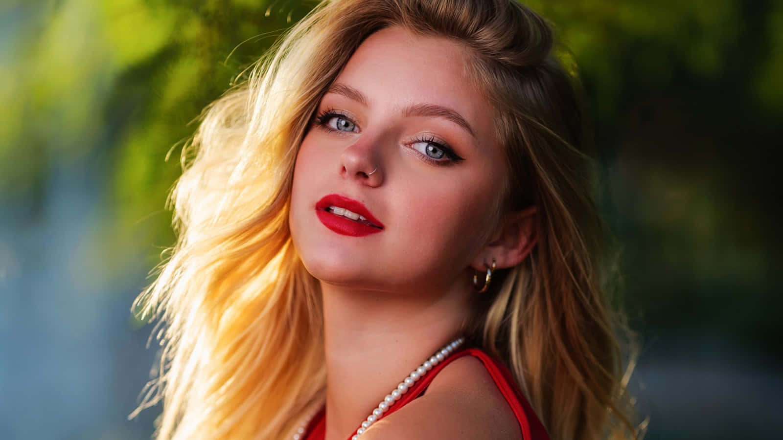 blonde ukrainian girl, blushing photoshoot, sunlit green backdrop, HD Desktop Wallpaper