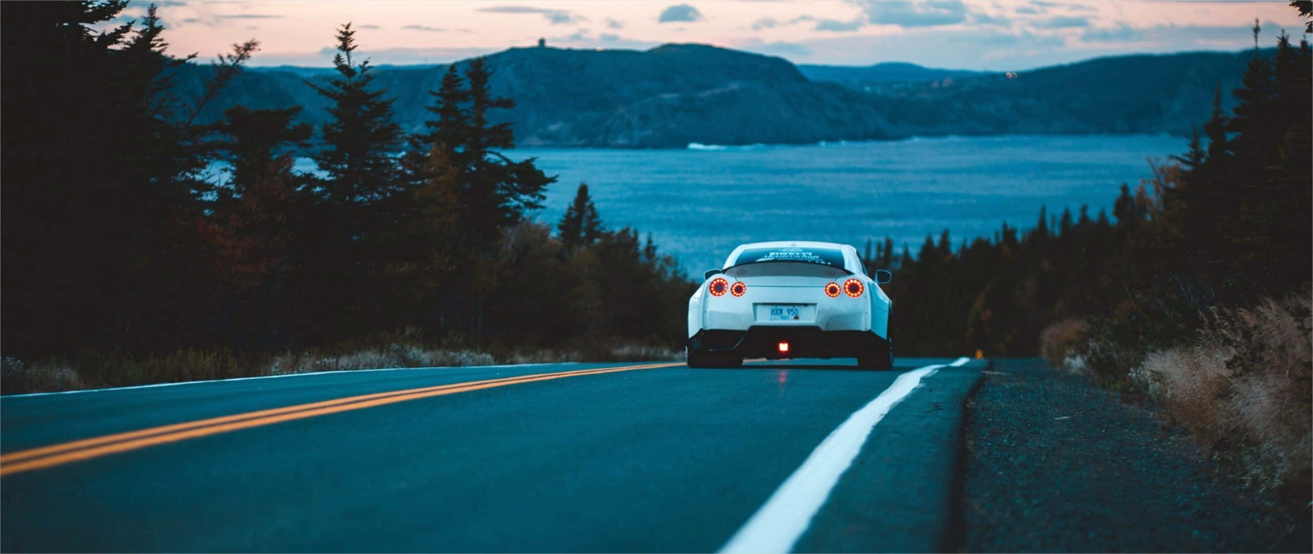 white sports car, winding road, dusk, 2K Desktop Wallpaper