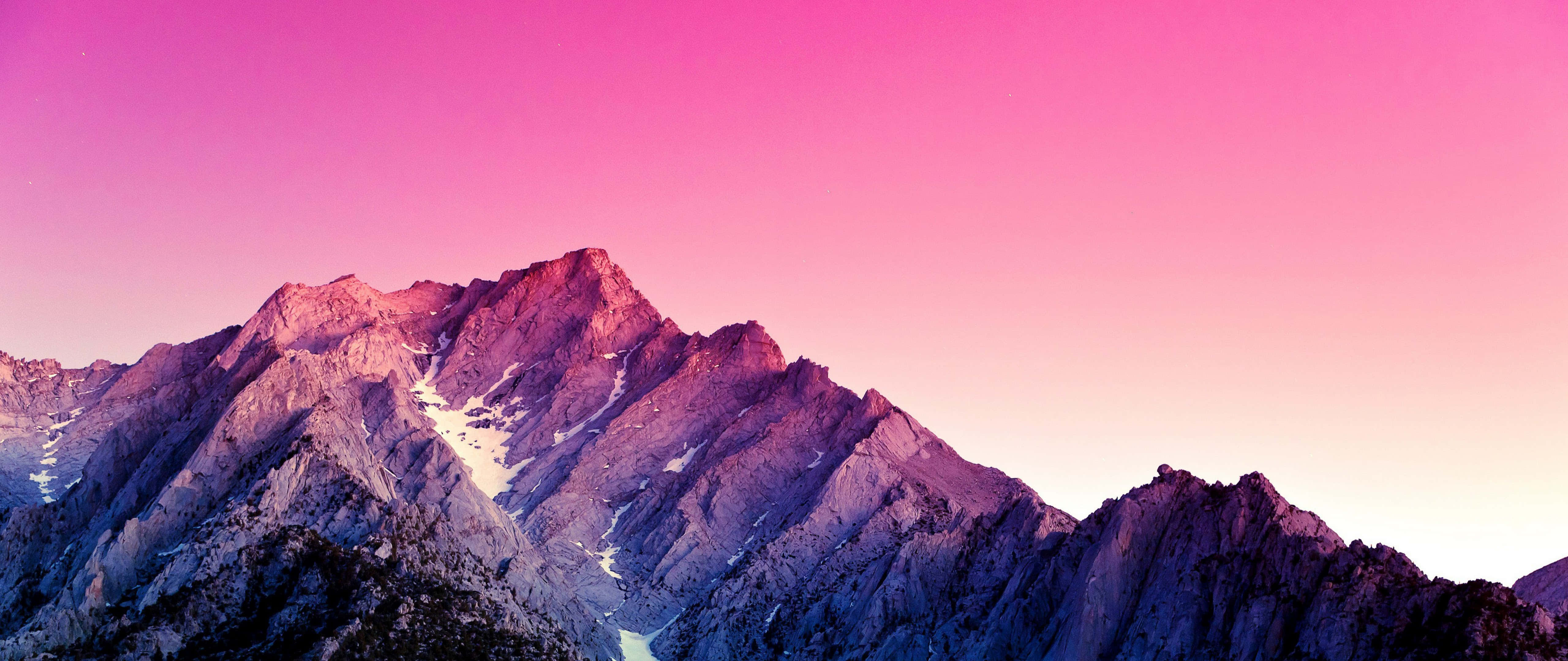 Ultra Wide lenses, jagged mountain range, vibrant pink and purple twilight hues, 5K Desktop Wallpaper
