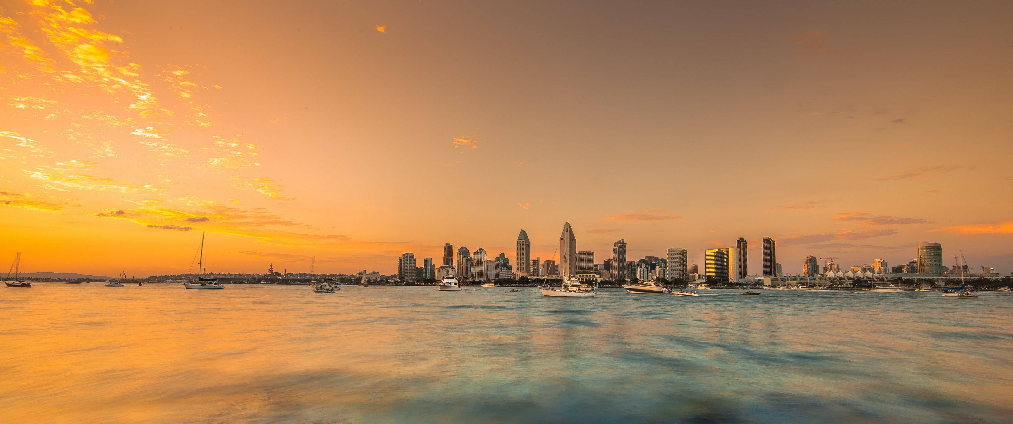 Ultrawide, sunset, coastal city skyline, 2K Desktop Wallpaper