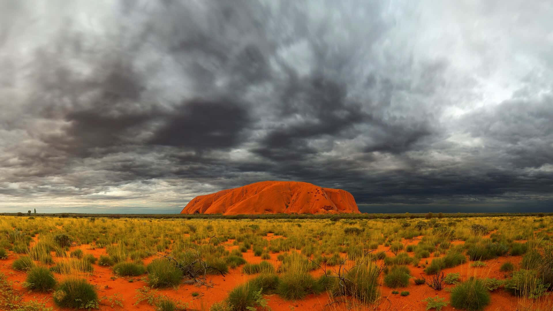 Uluru, red sand dunes, dramatic stormy sky, Full HD Desktop Wallpaper