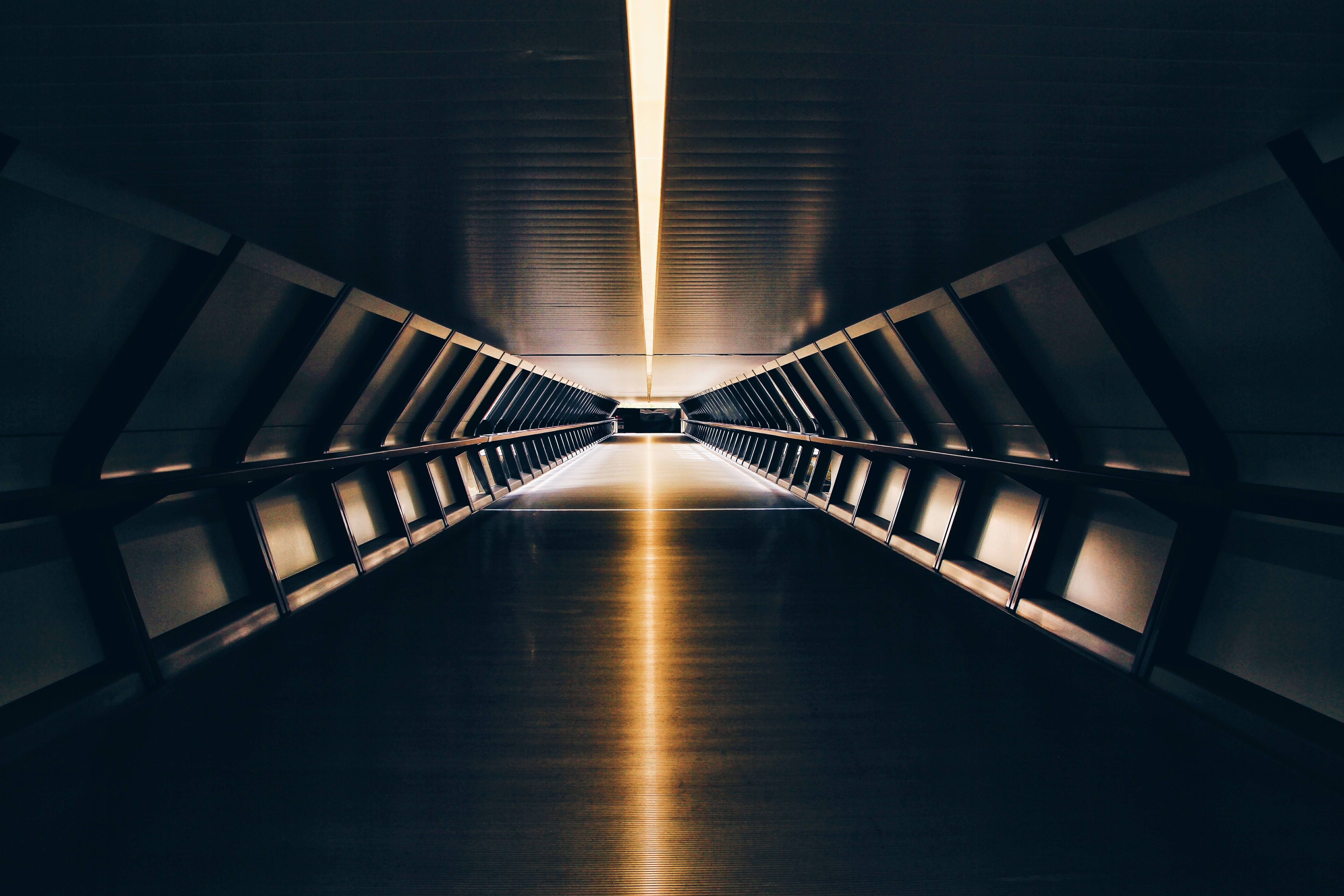 futuristic underground tunnel, metallic walls, glowing golden light, 5K Desktop Wallpaper